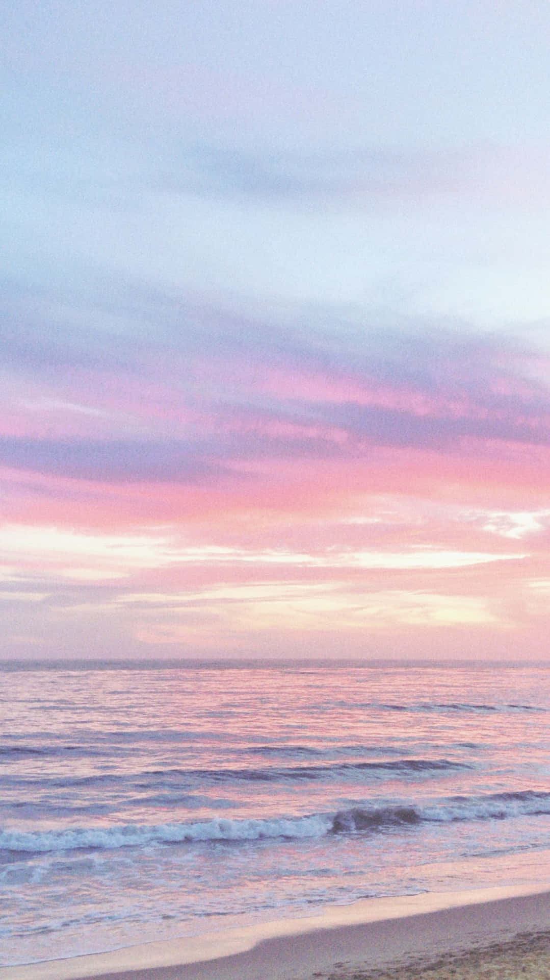 Paraísolleno De Felicidad: Una Pintoresca Playa De Tonos Pastel Te Espera. Fondo de pantalla
