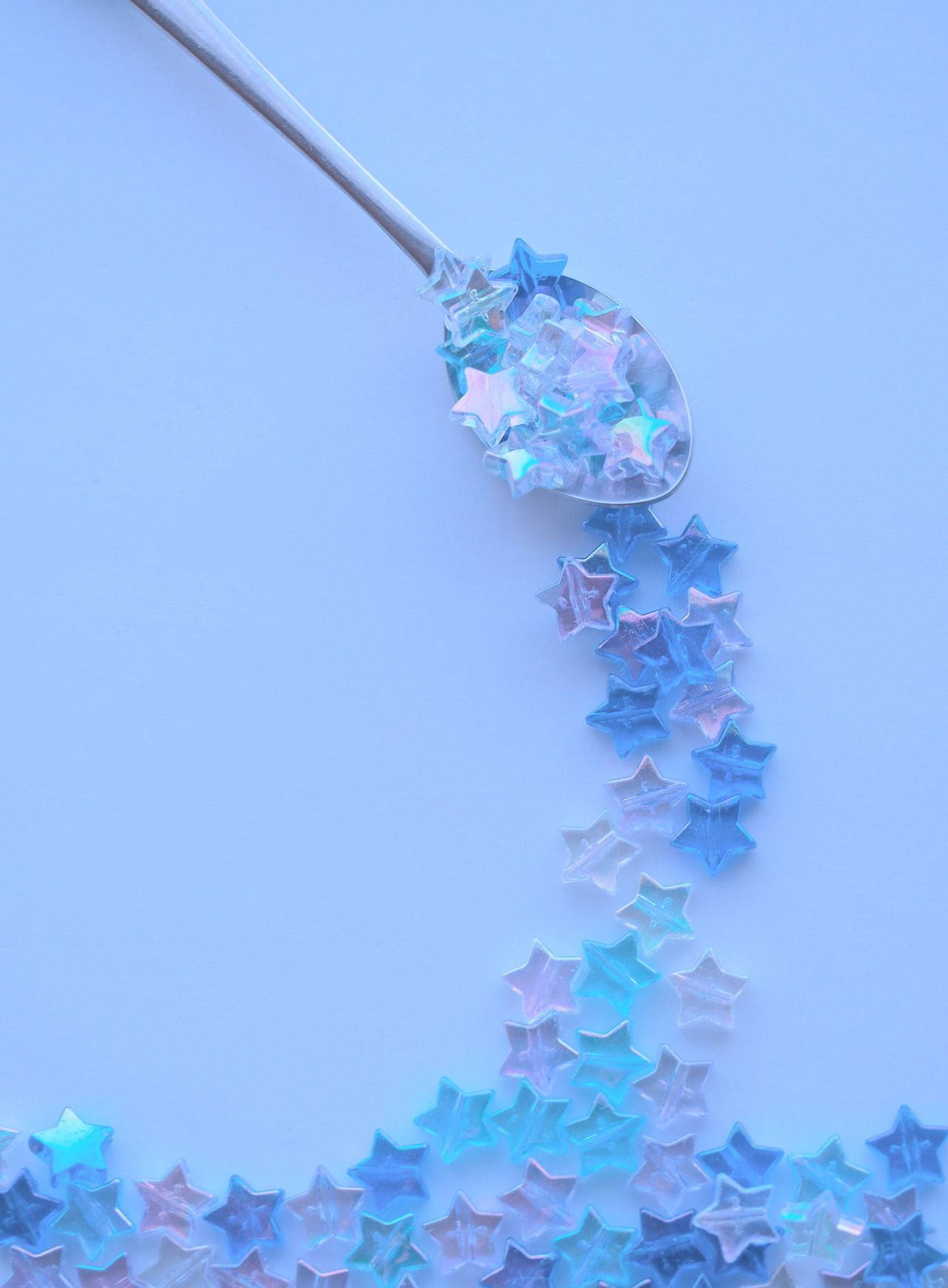 A Spoon With Stars On It Wallpaper