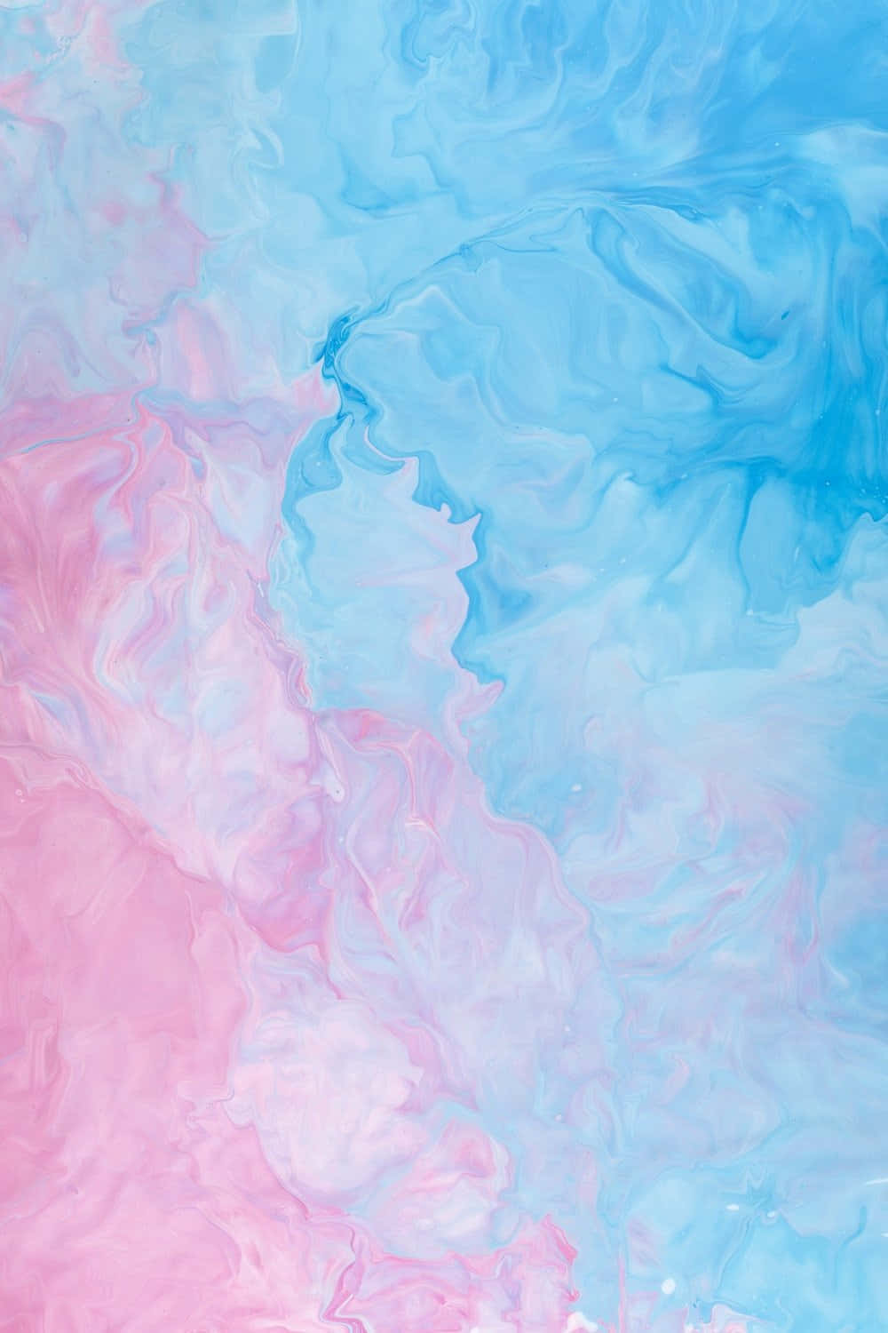An image of a dream-like background featuring soft pastel blue and pink hues Wallpaper