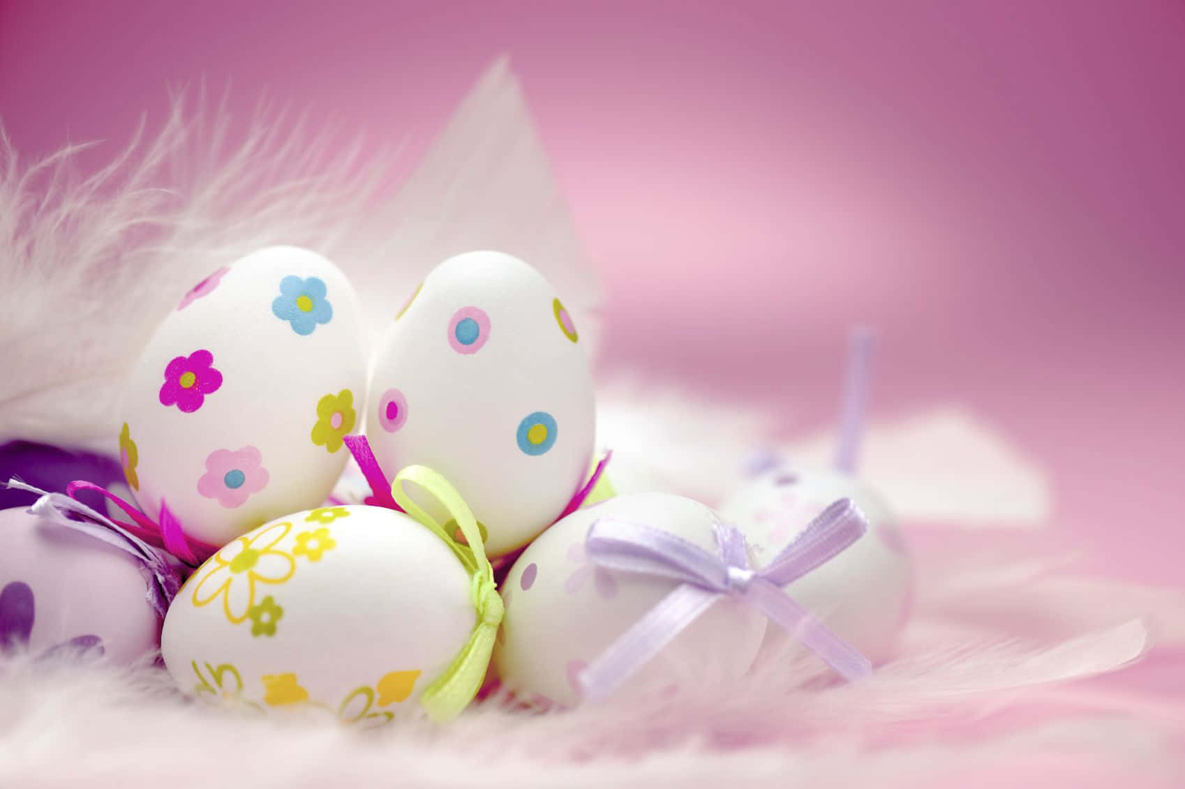 A vibrant Pastel Easter scene with colorful eggs, flowers, butterflies and more.