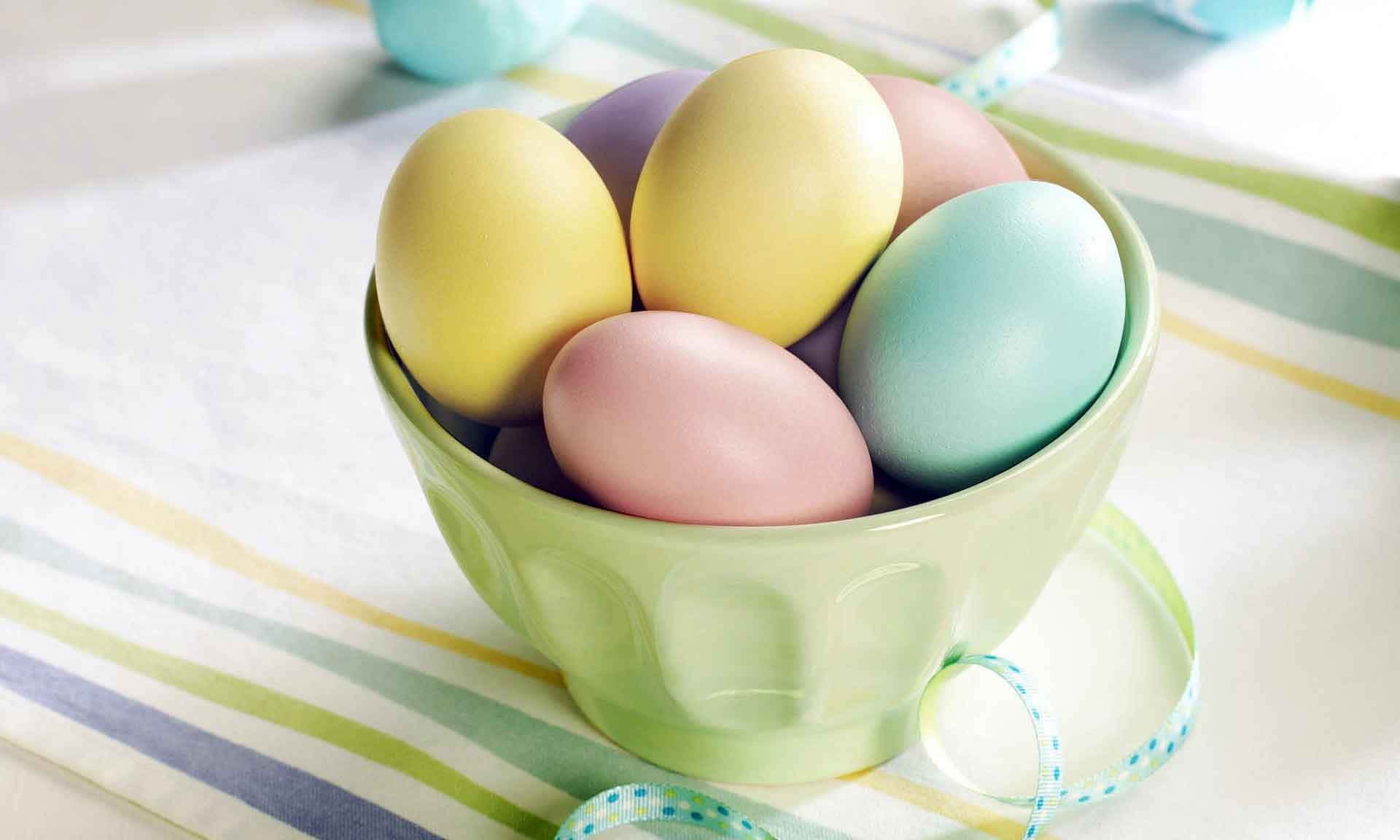 A beautiful pastel background with Easter eggs and bunnies for a festive celebration.