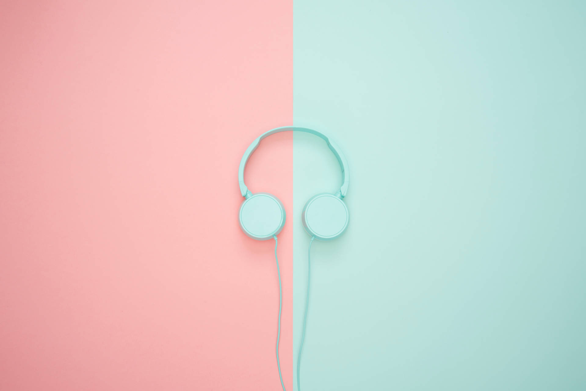 Bring Your Music to Life with These Pastel Green Headphones Wallpaper