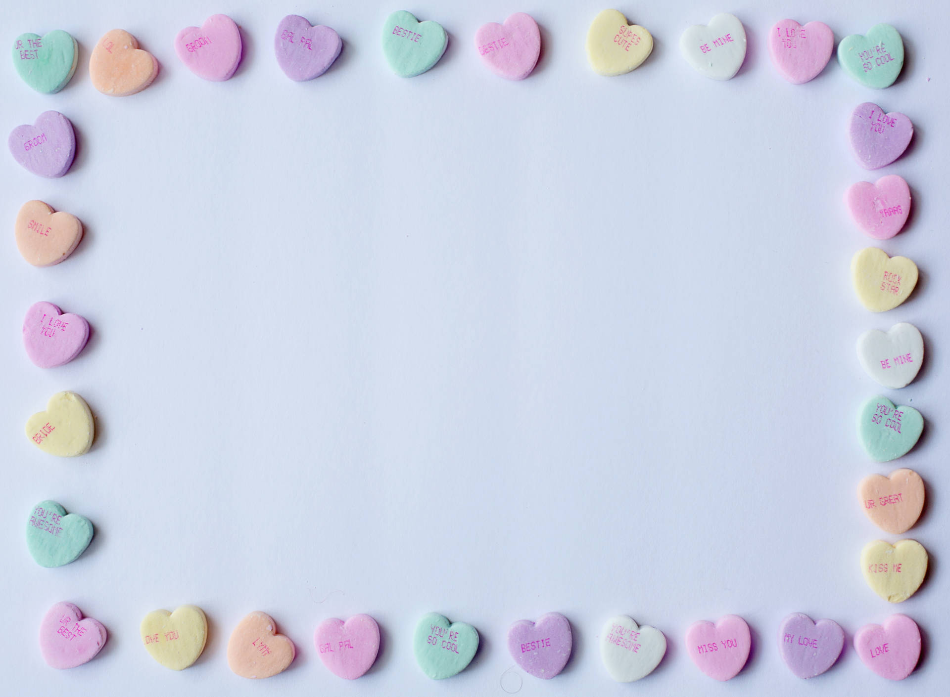 Pastel Pink Heart Candies Forming Border Wallpaper