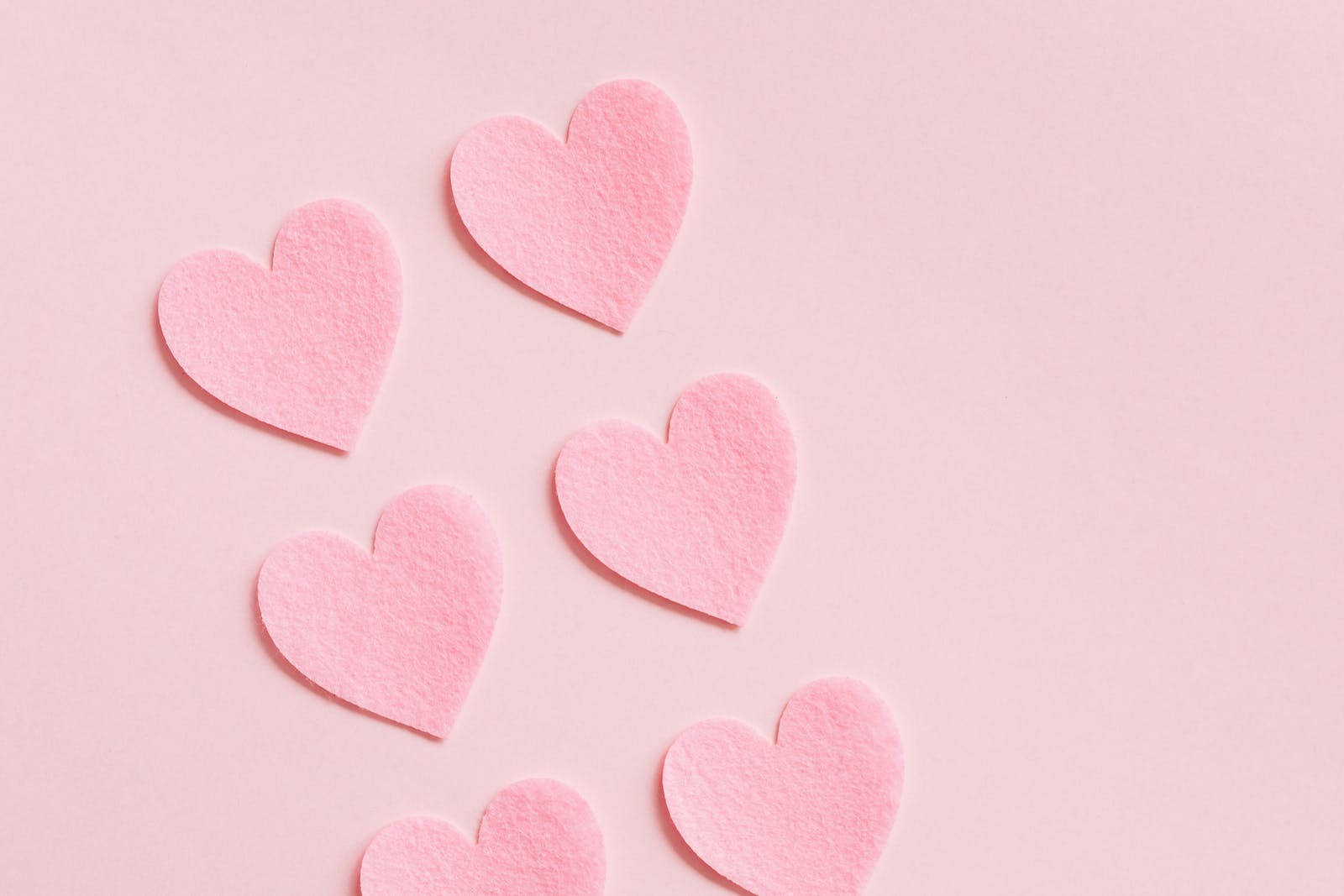 Pastel Pink Heart Cutouts In Pairs Wallpaper