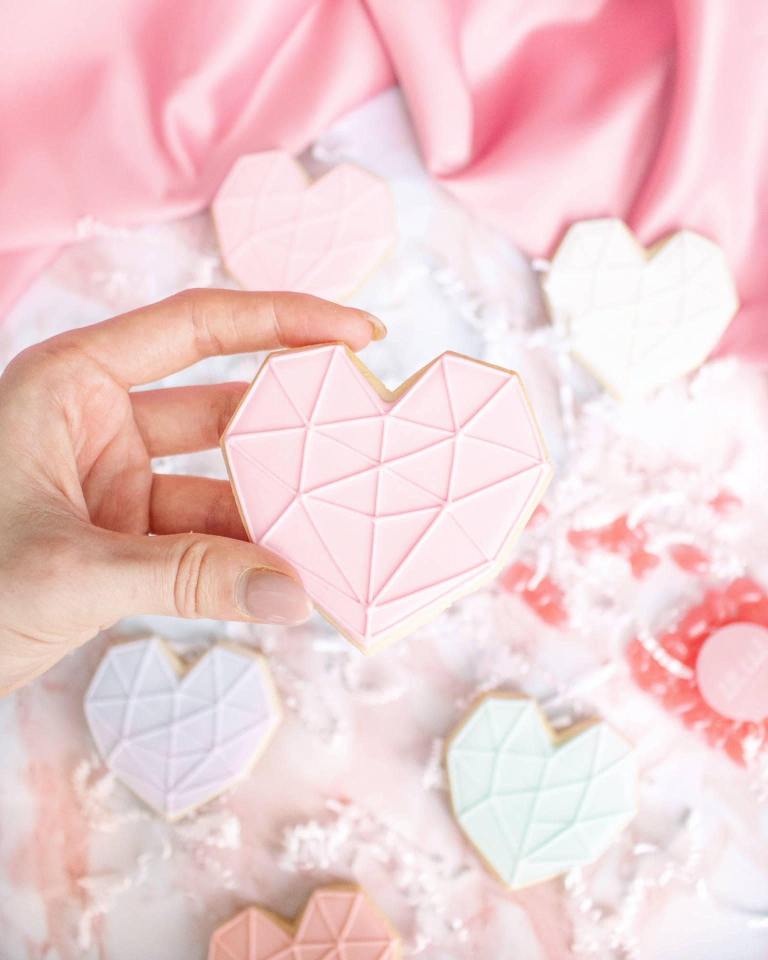 Biscoitode Açúcar Em Formato De Coração Rosa Pastel. Papel de Parede