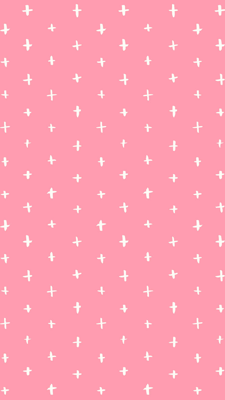 A Pink Background With White Crosses On It Wallpaper