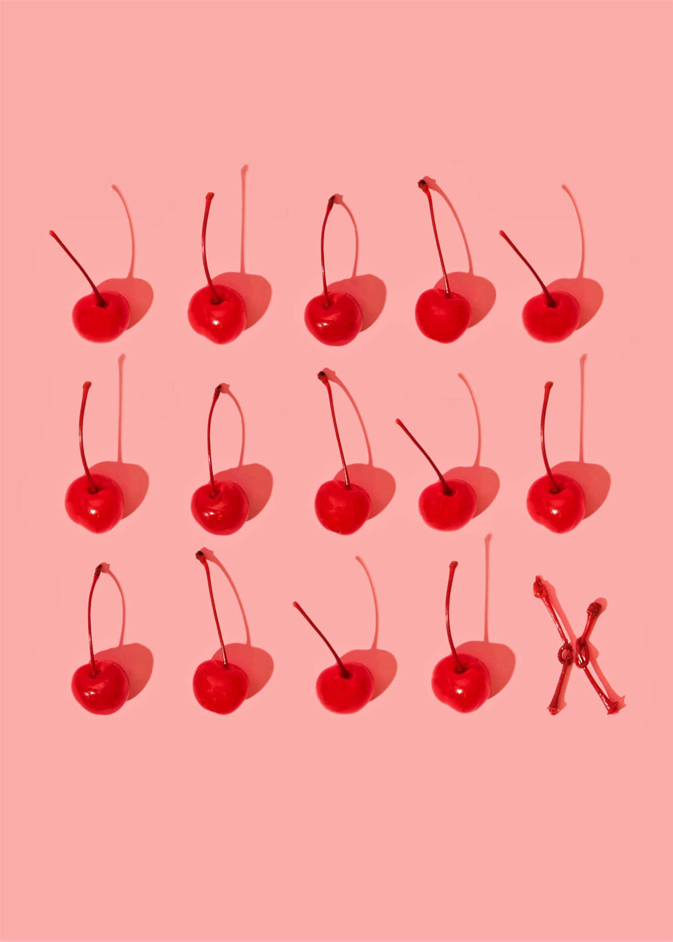 A Group Of Cherries On A Pink Background Wallpaper