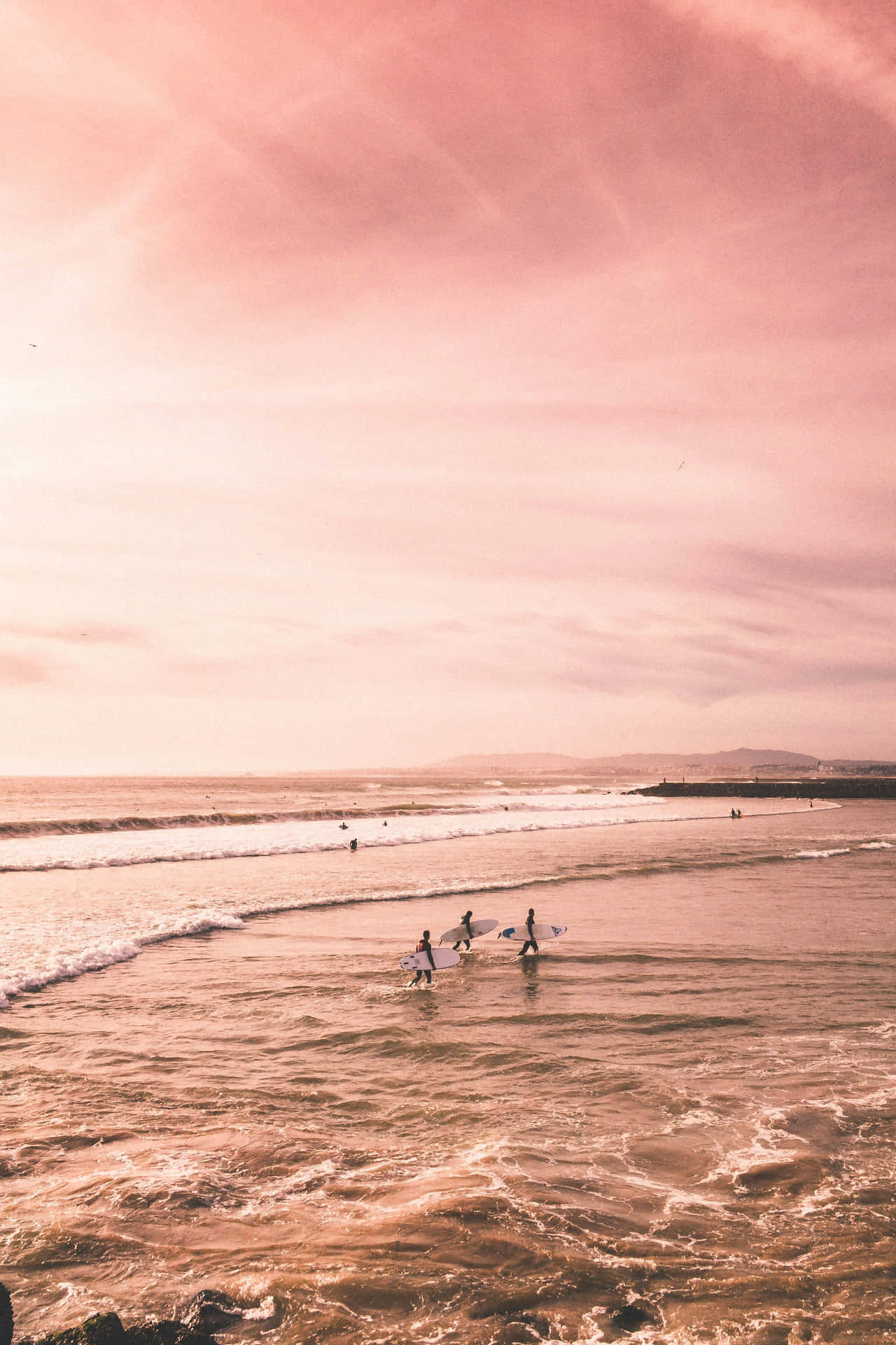 Pastel Sunset Surfers Beach Wallpaper
