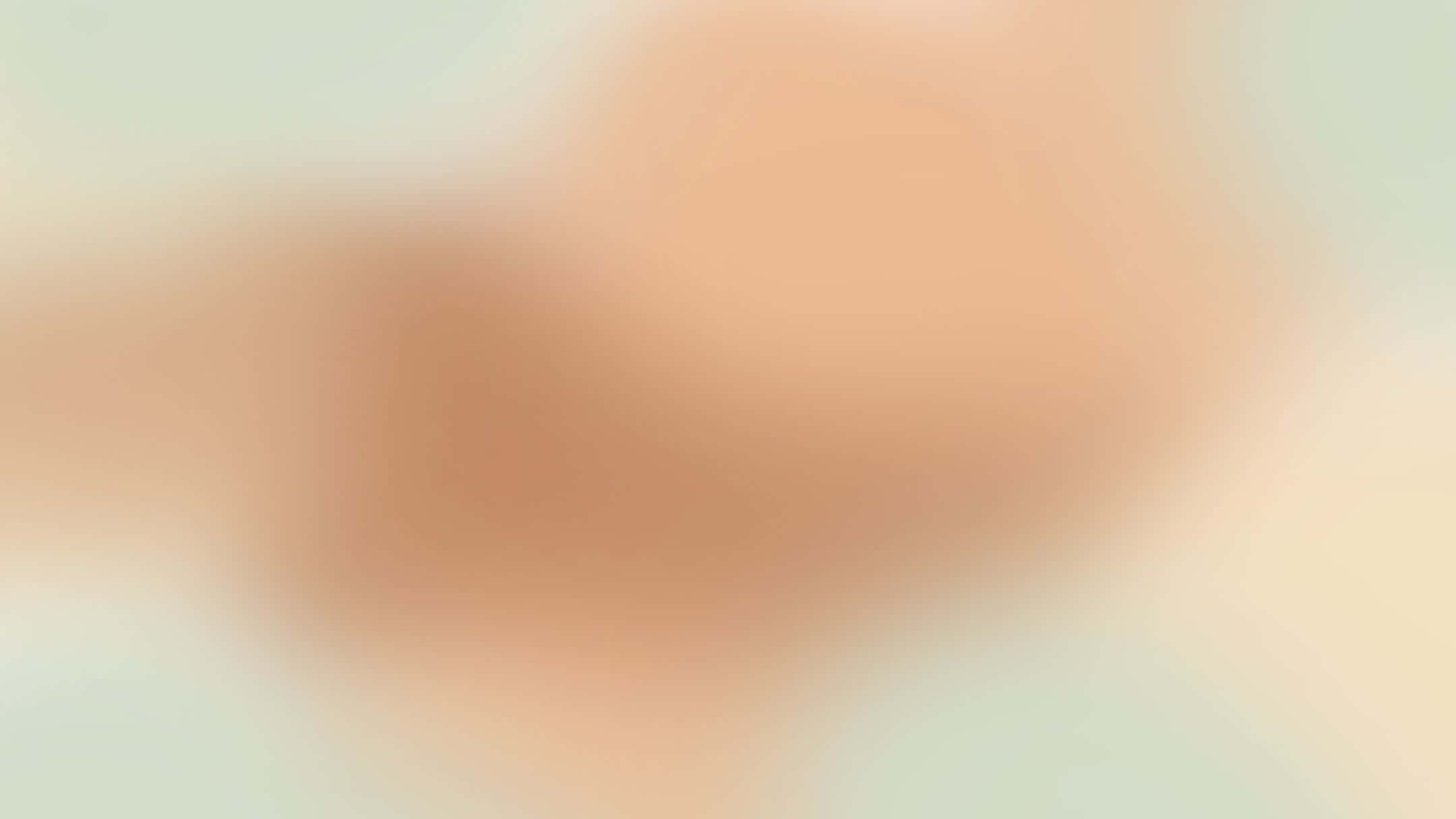 A Close Up Of A Beige Background With A Blurred Background