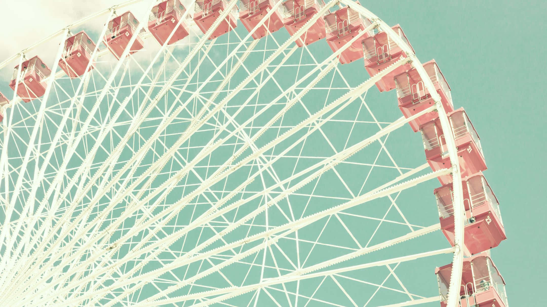 A Ferris Wheel With A Pink And White Color Scheme