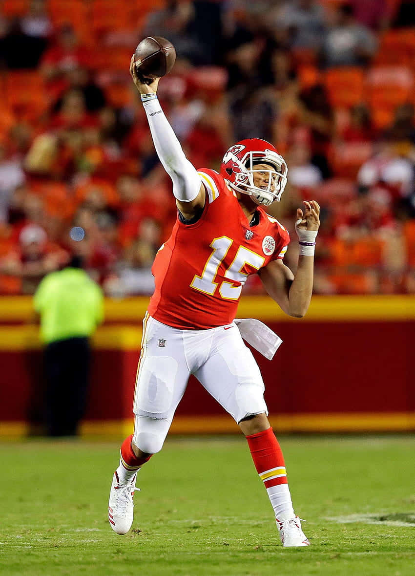 Pat Mahomes celebrates with his phone after the Super Bowl Wallpaper
