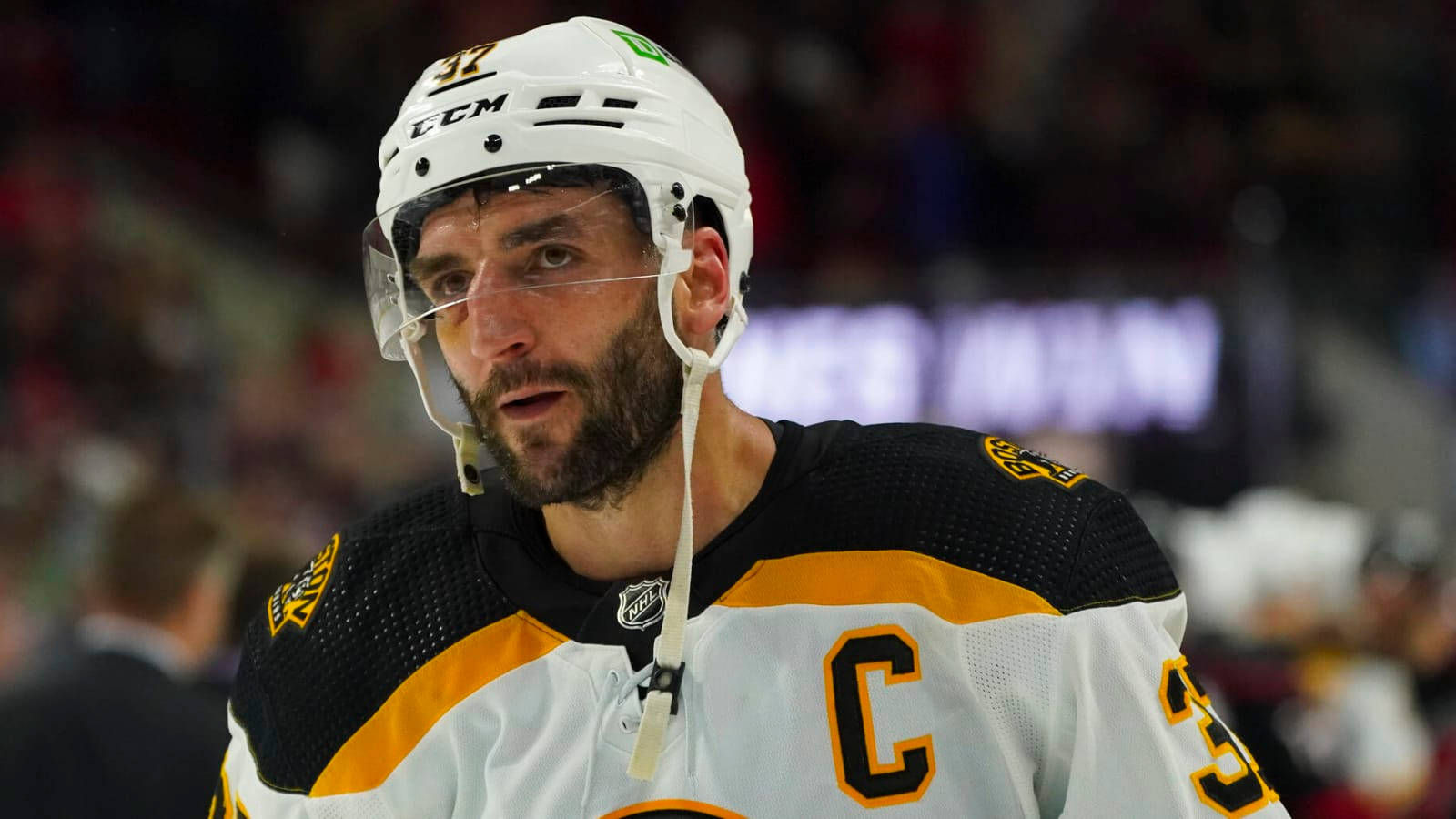 "Patrice Bergeron in action, donning the Boston Bruins white uniform." Wallpaper