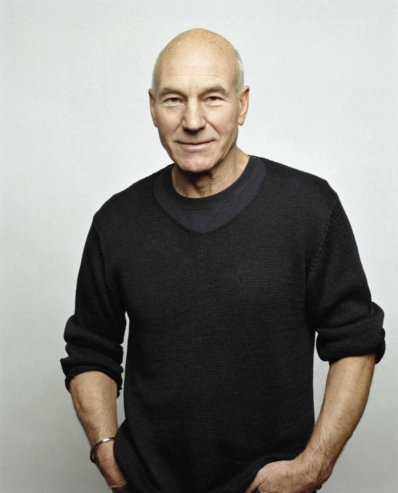Acclaimed actor Patrick Stewart sporting a classic black knitted sweater Wallpaper