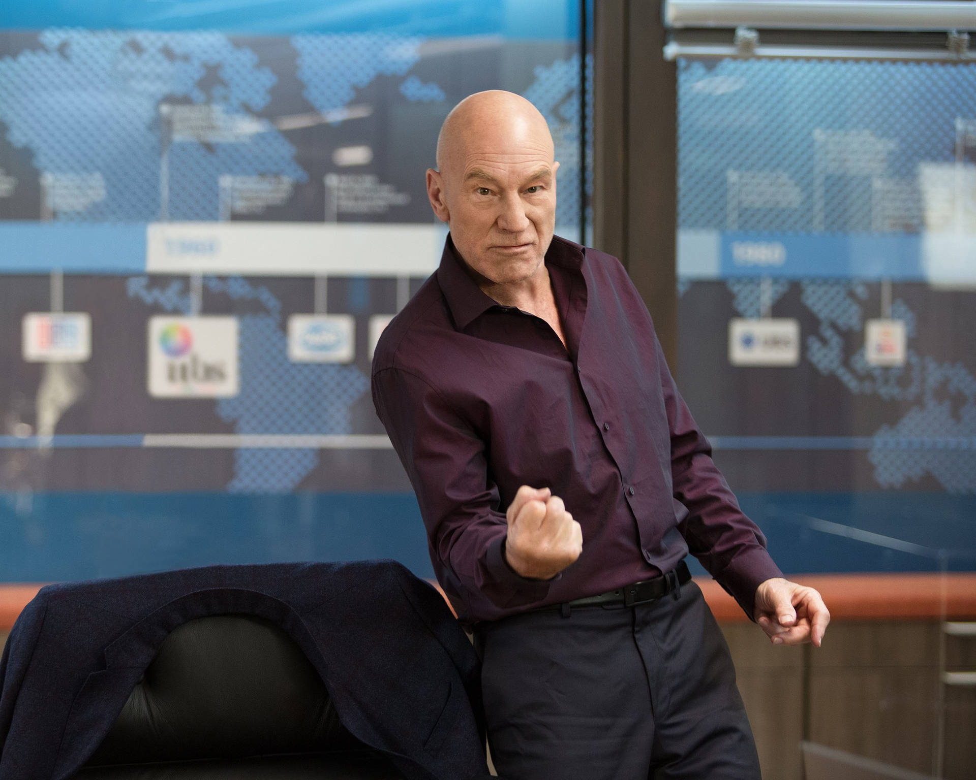 Sir Patrick Stewart, exuding ambition and success in a powerful pose Wallpaper