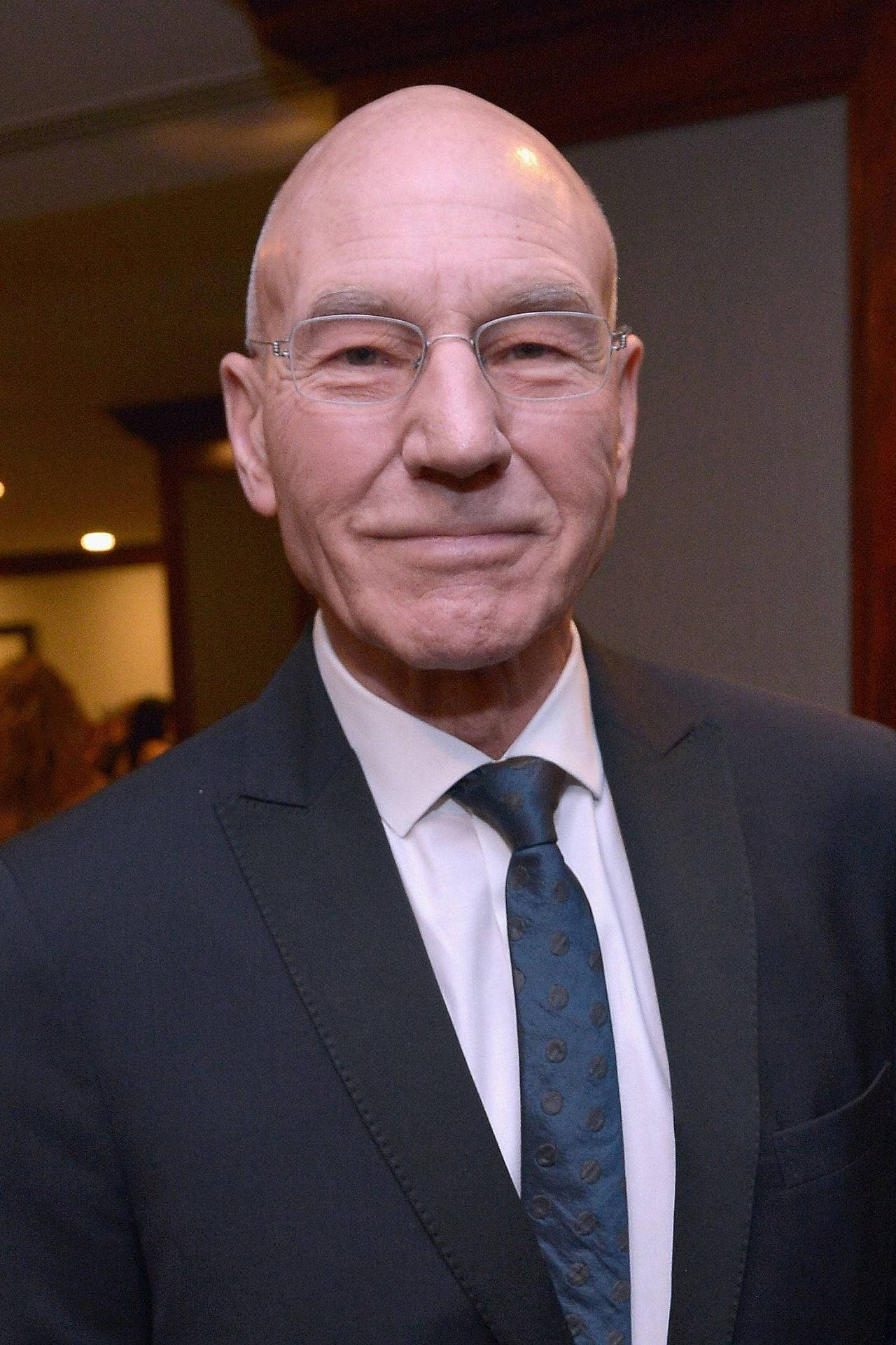 Patrick Stewart With A Beaming Smile Wallpaper