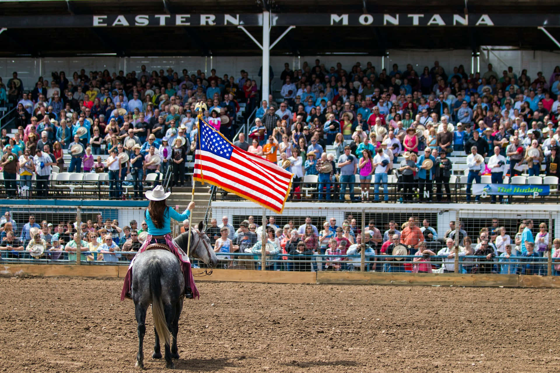 Patriotic Rodeo Performancewith American Flag Wallpaper