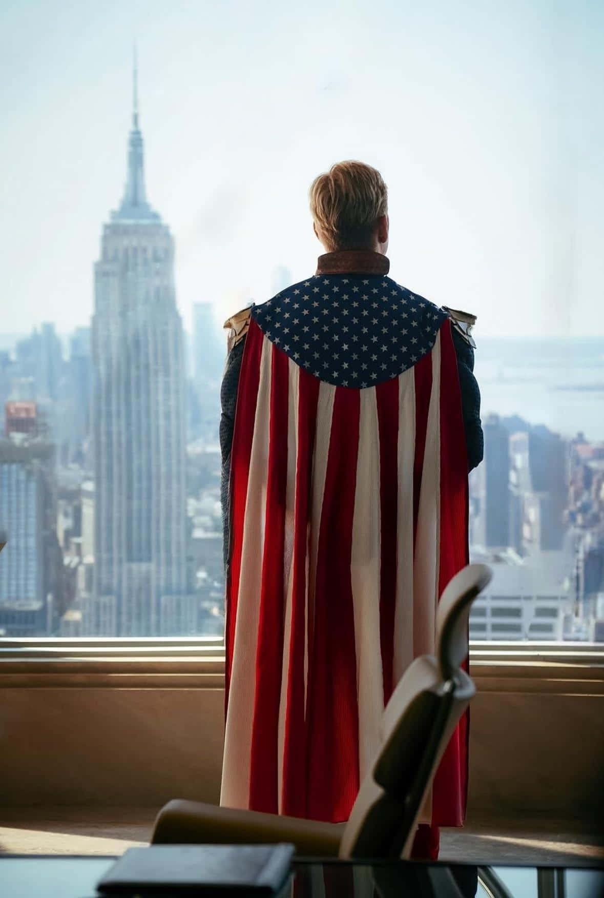 Patriotic Superhero Overlooking City Wallpaper