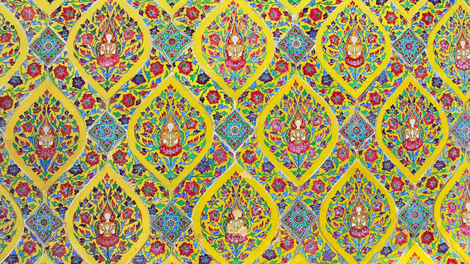 a yellow and blue paisley pattern on a yellow background