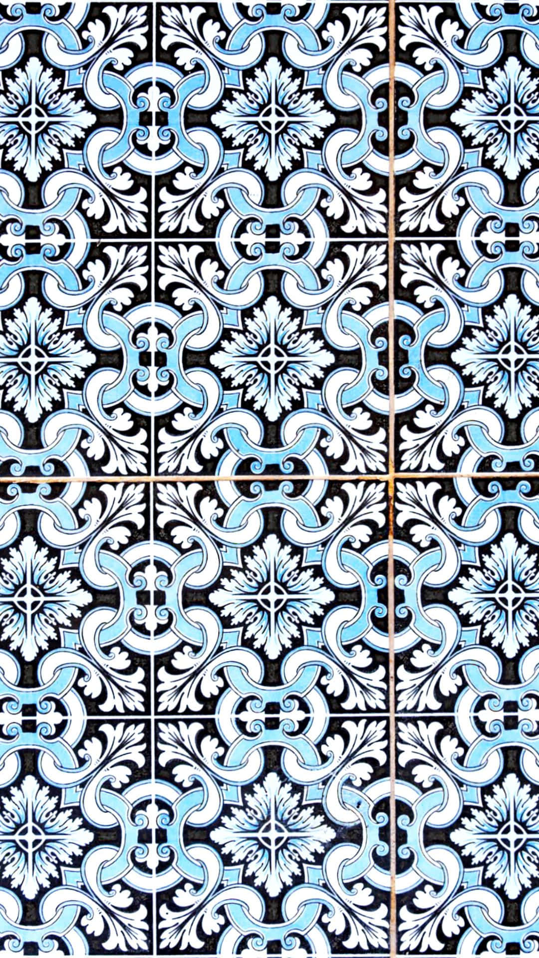 A Tile With Blue And White Designs