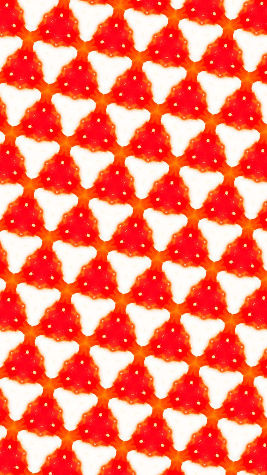 a red and white pattern with triangles