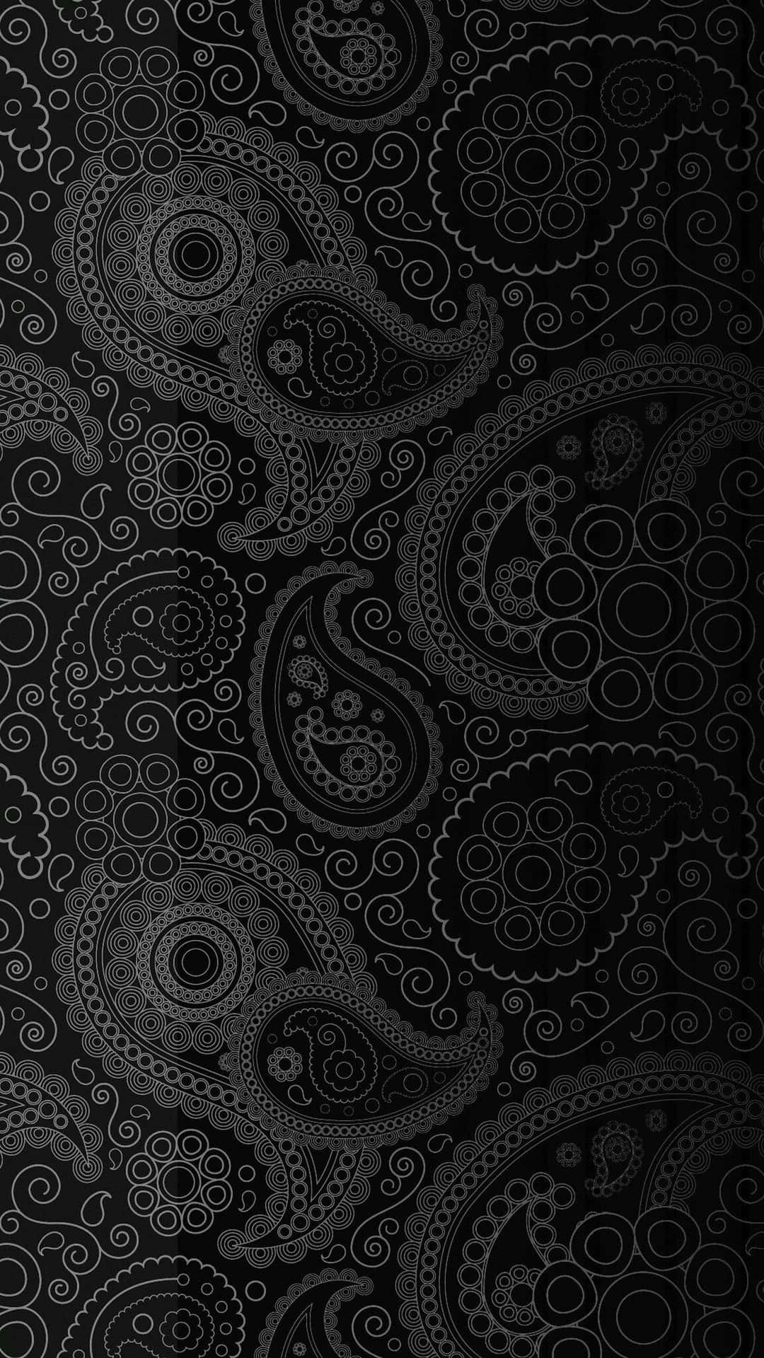A Black And White Paisley Pattern On A Black Background Wallpaper