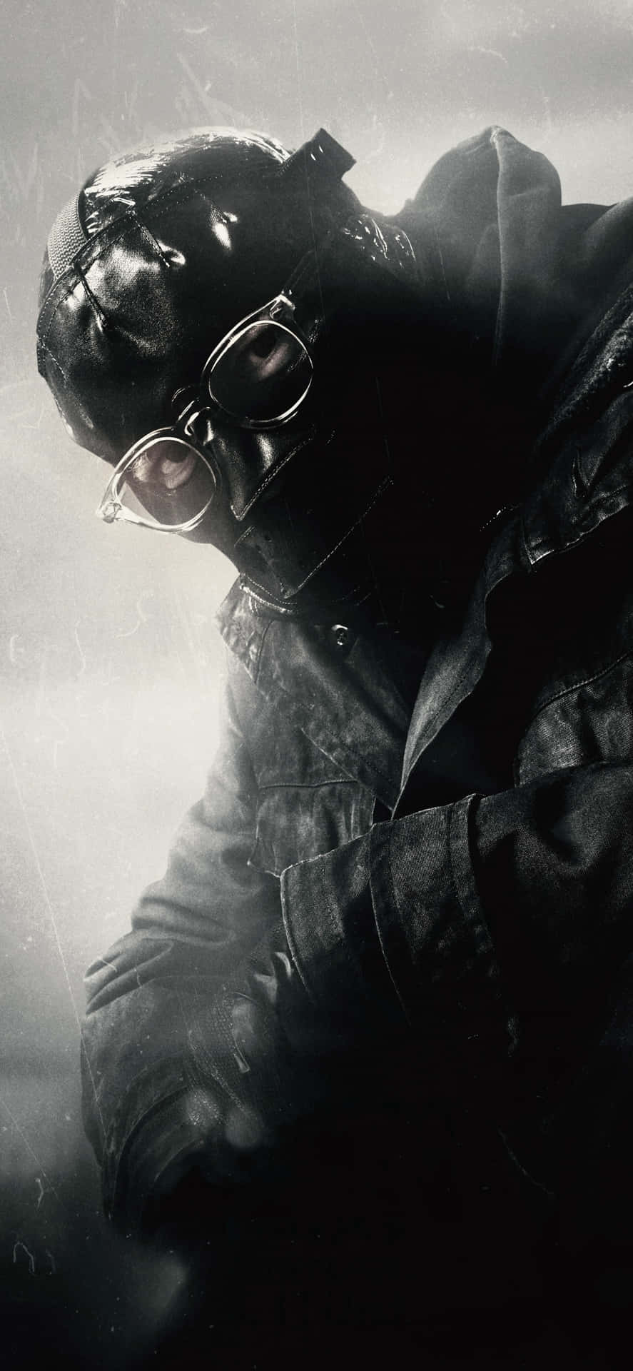a man in a gas mask is holding a gun Wallpaper