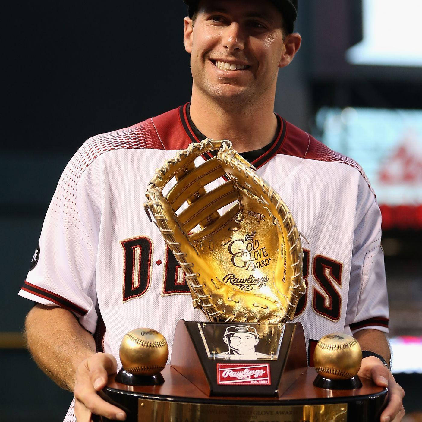 Download Paul Goldschmidt proudly holding his Gold Glove Award