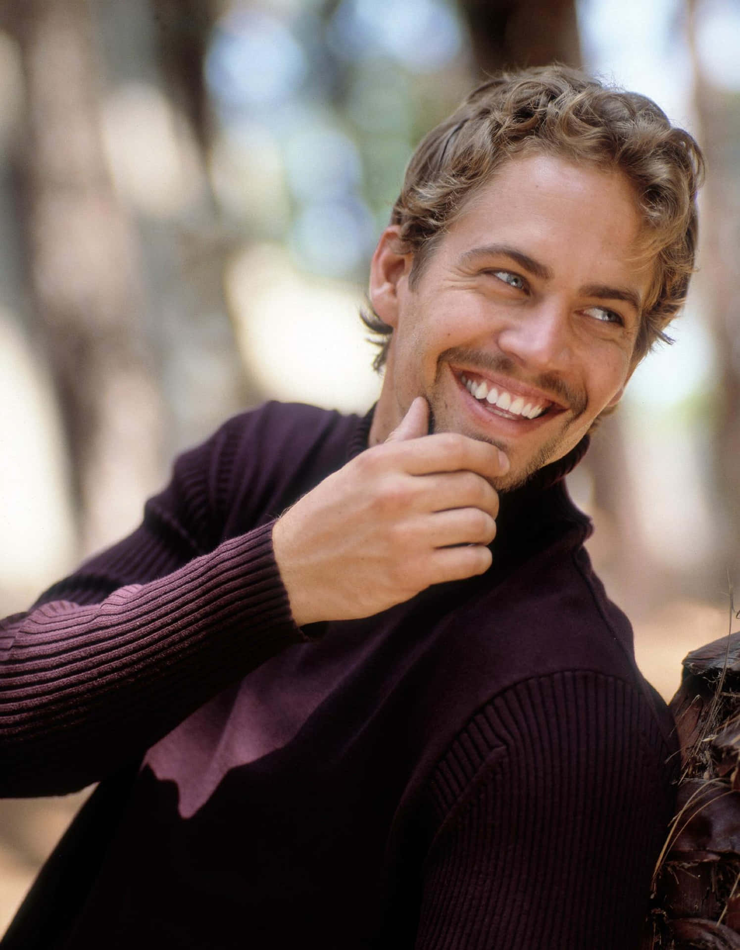 Paul Walker wearing a casual outfit while posing for the camera