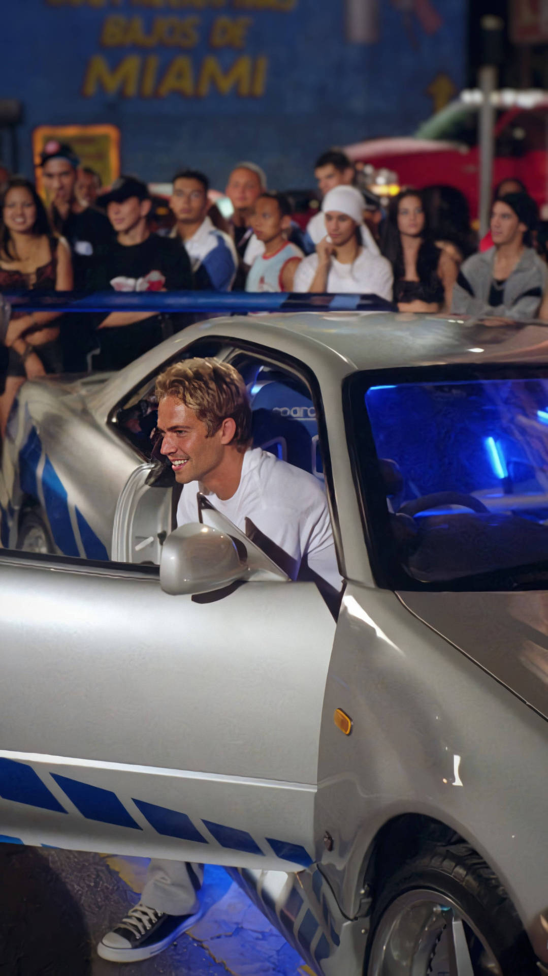 Paul Walker kører sin bil i en ikonisk scene fra Fast and Furious franchise Wallpaper