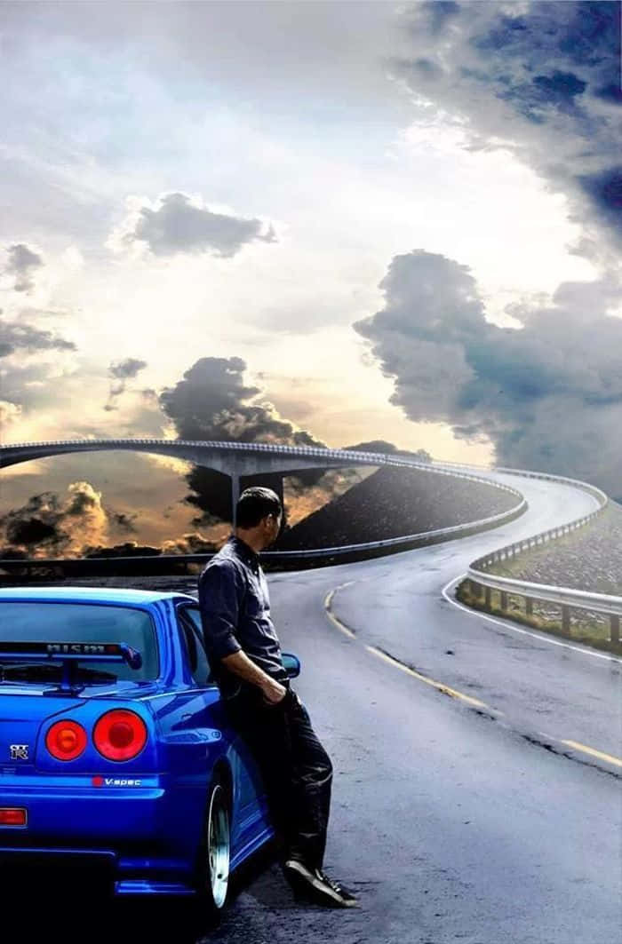 Paul Walker kører hurtigt gennem natten i hans Nissan Skyline. Wallpaper