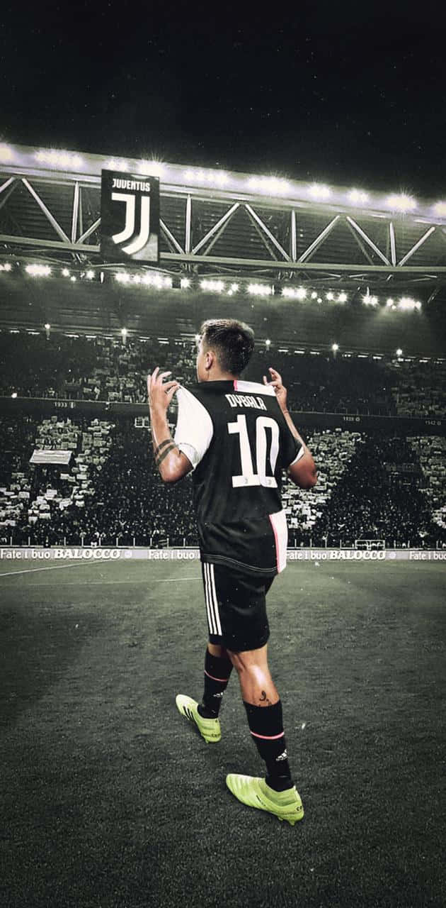 Paulo Dybala In Mid-action On The Soccer Field Wallpaper