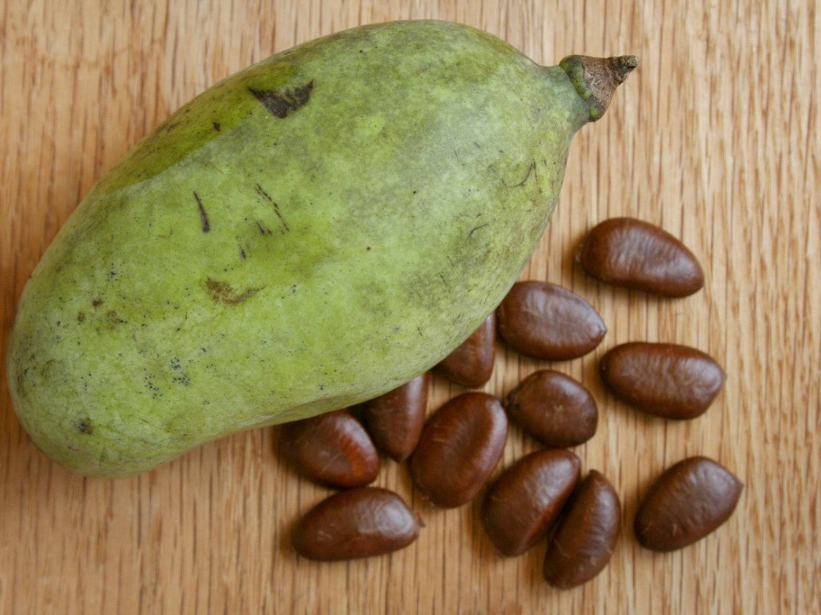 Pawpaw Fruit With Its Dry Seeds Wallpaper