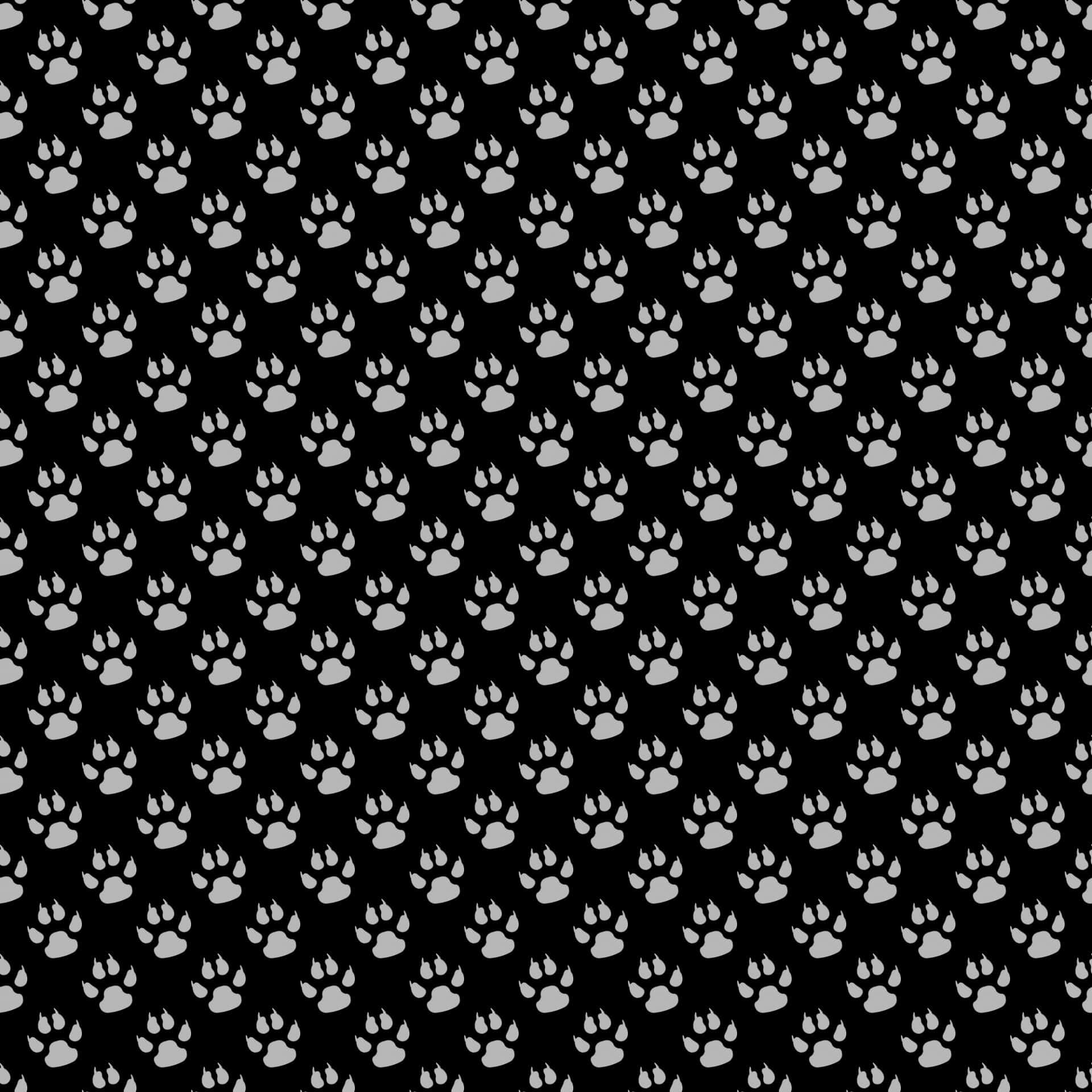 A Black And White Pattern With Paw Prints