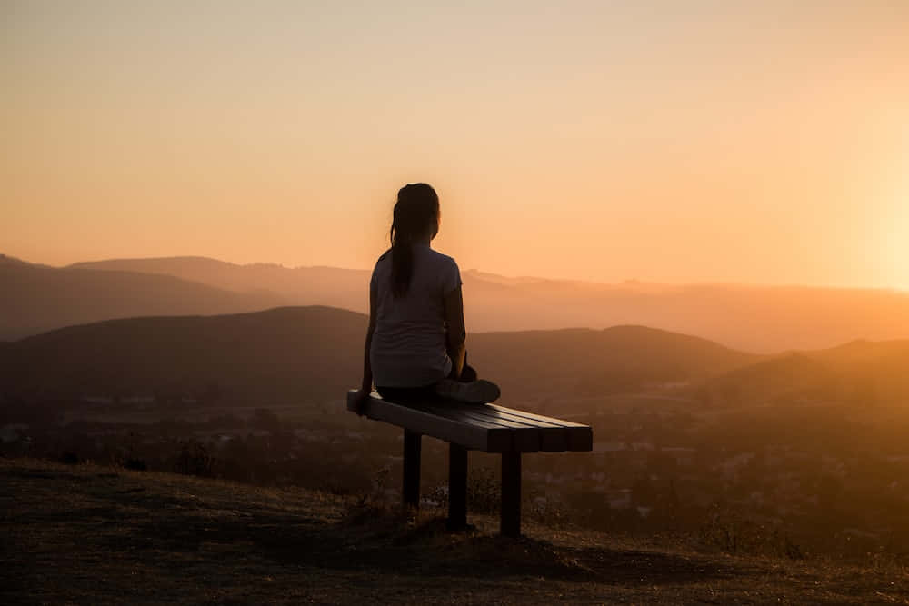 Silhouette Girl Sitting On Peaceful Bench Picture