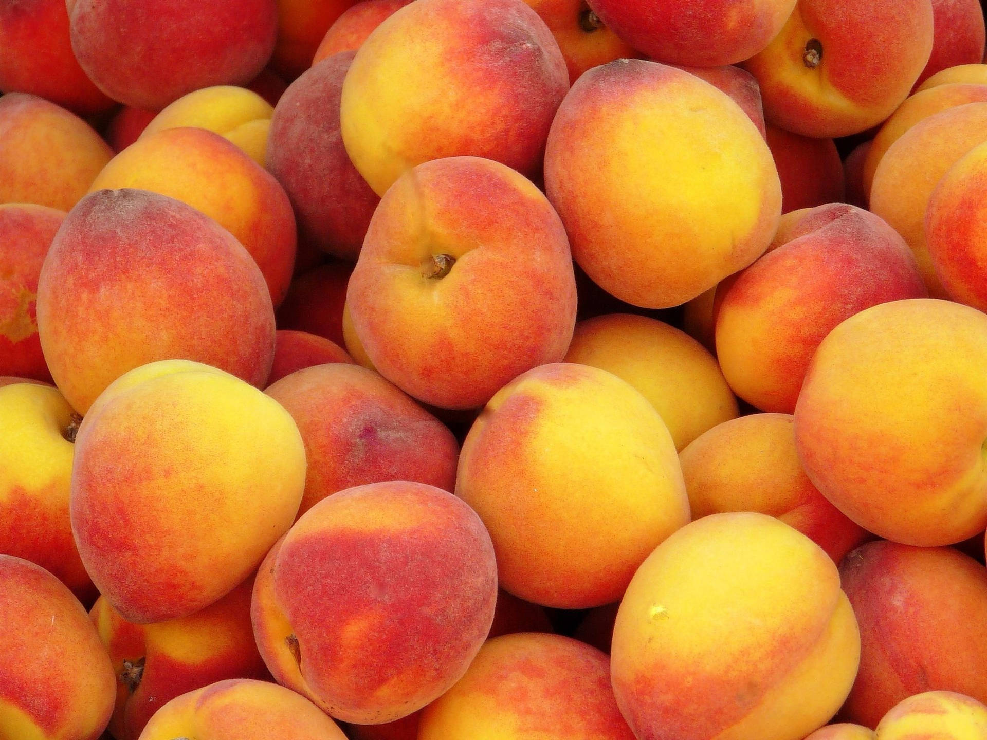 Peach Fruit Pile Top View Wallpaper