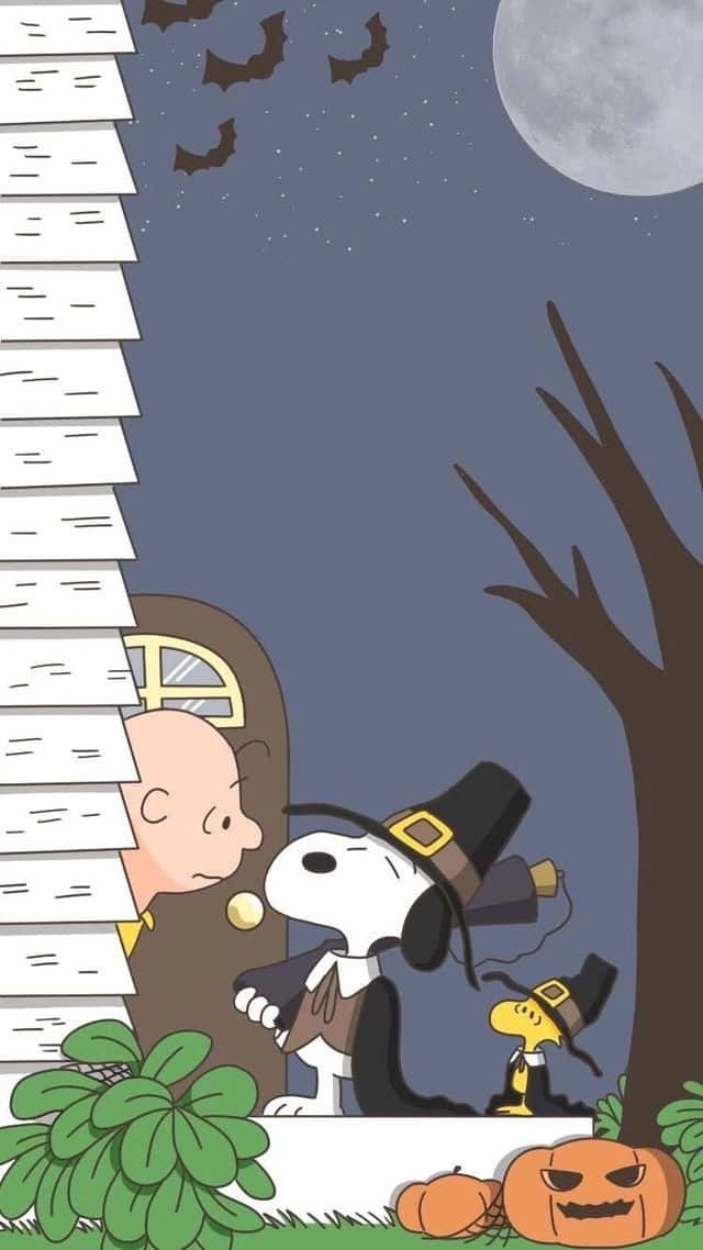 "Charlie Brown gets ready for Halloween with his pumpkin in tow" Wallpaper