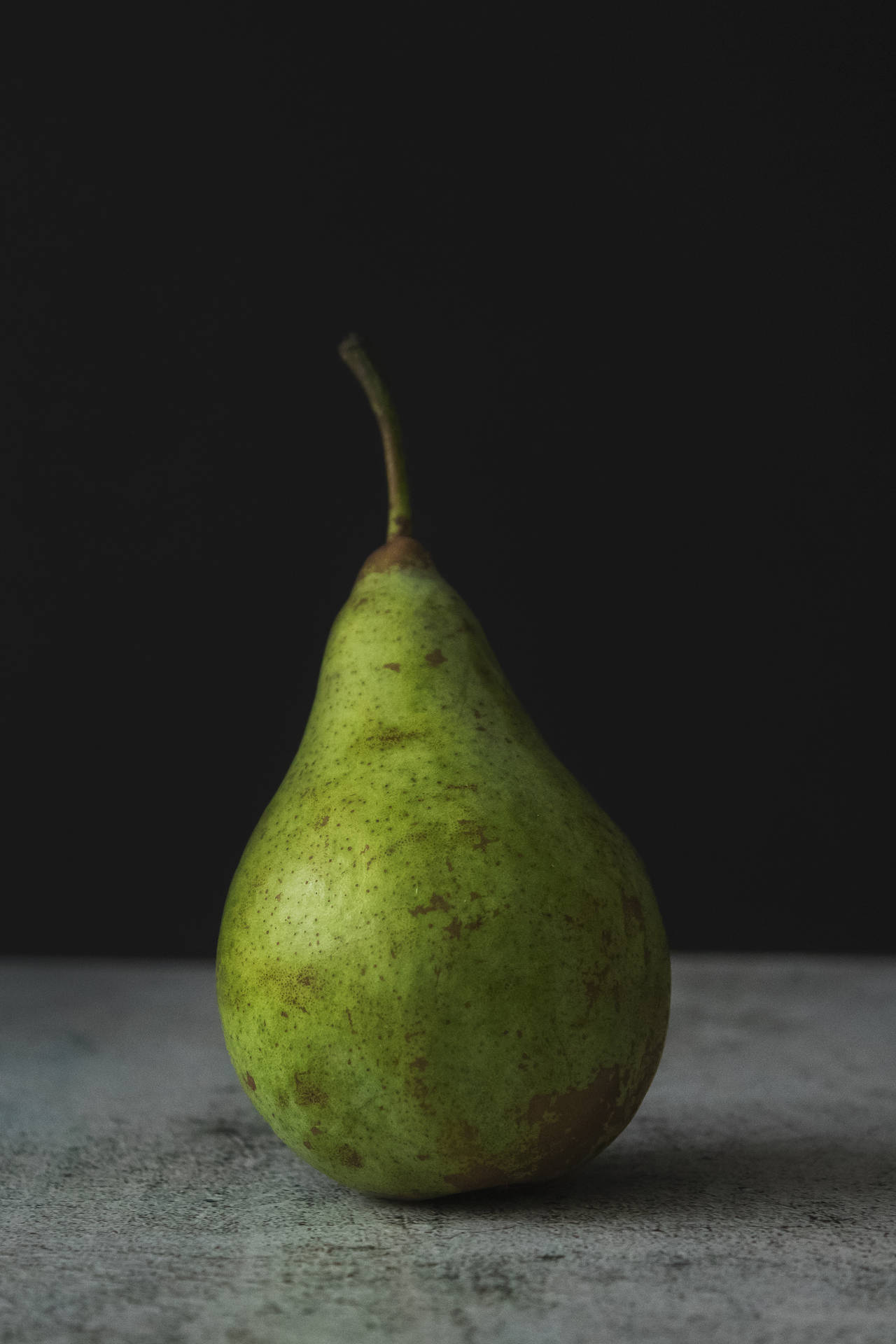 Pear Fruit On Concrete Surface