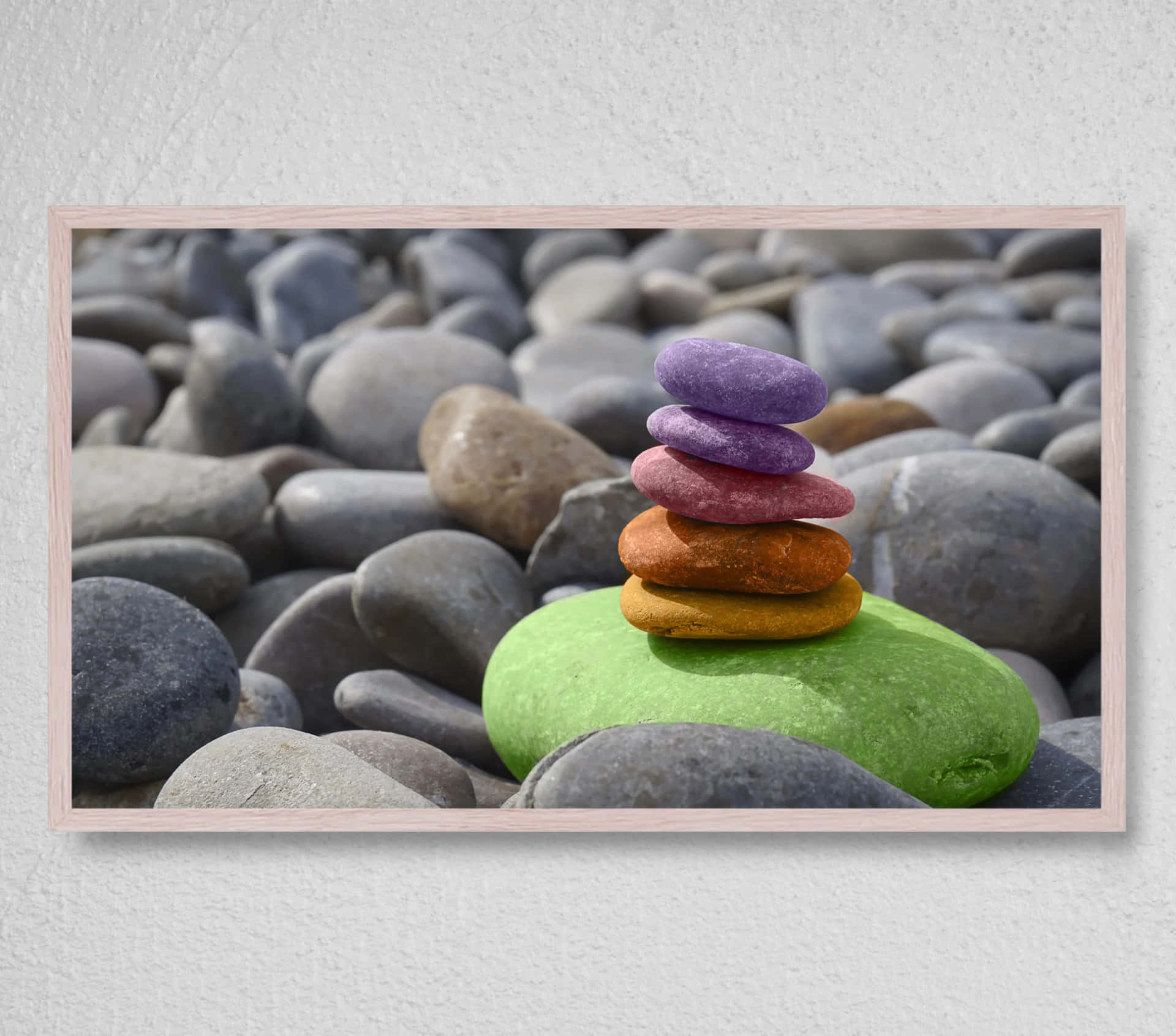 A Framed Picture Of Colorful Rocks On A White Background