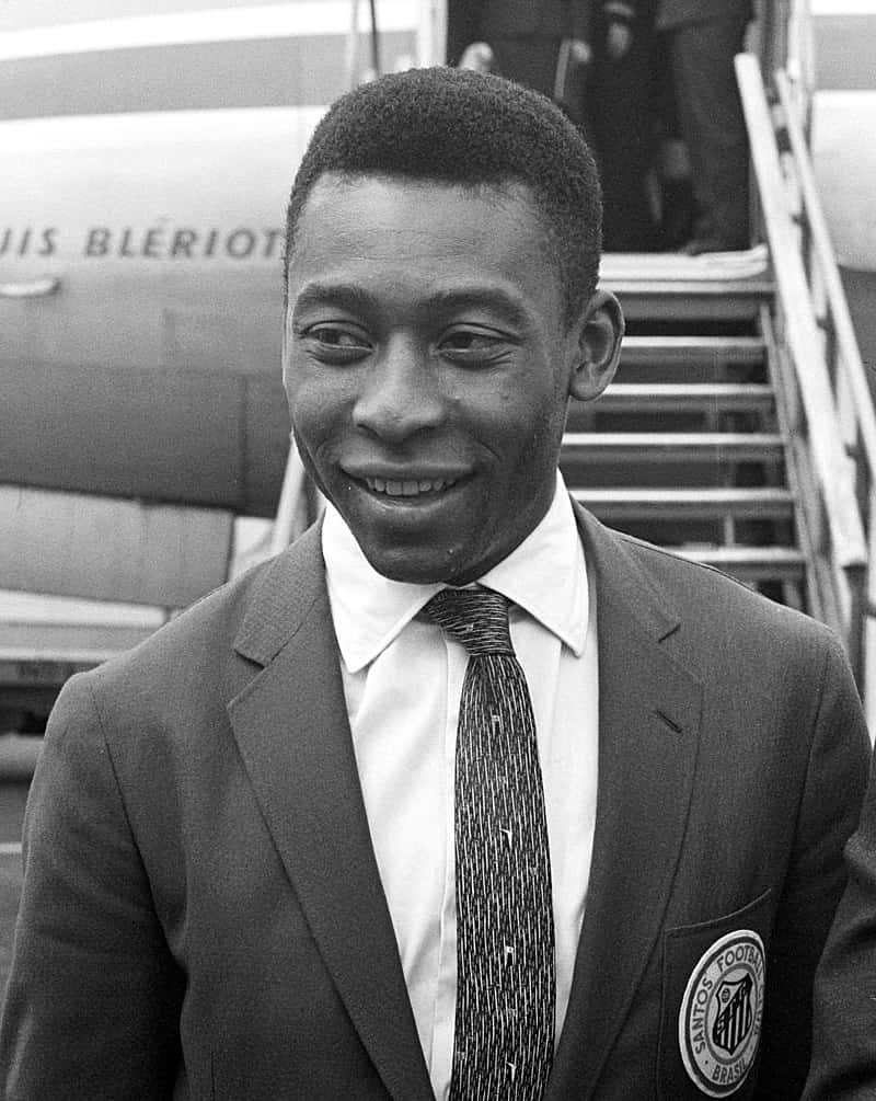 Download Pele Smilingin Suit Wallpaper | Wallpapers.com