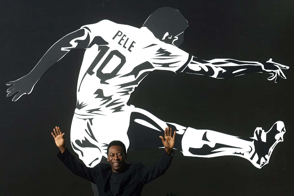 Pele Taking A Picture With His Impeccable Game Pose Wallpaper