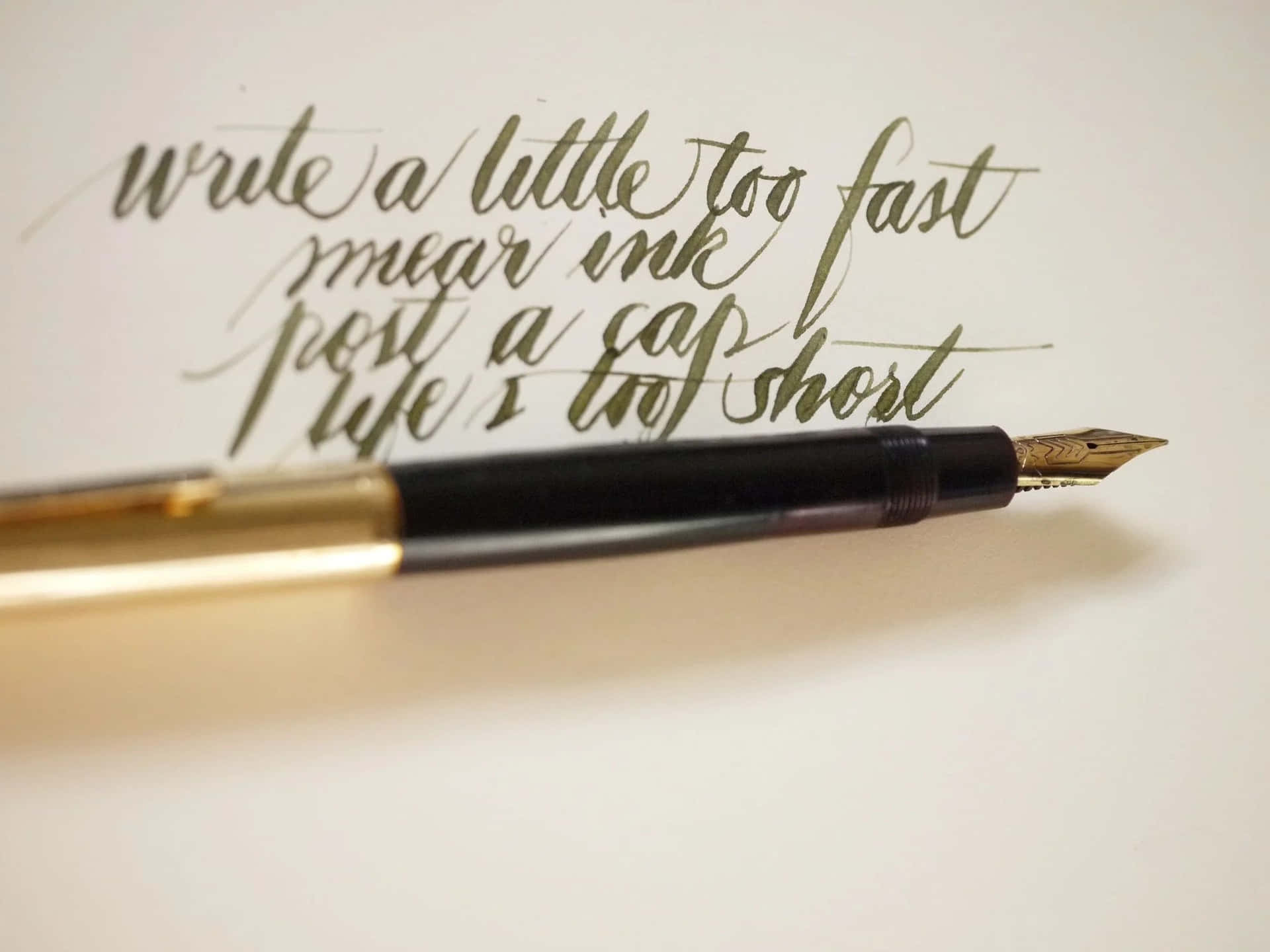 A Fountain Pen With A Quote Written On It