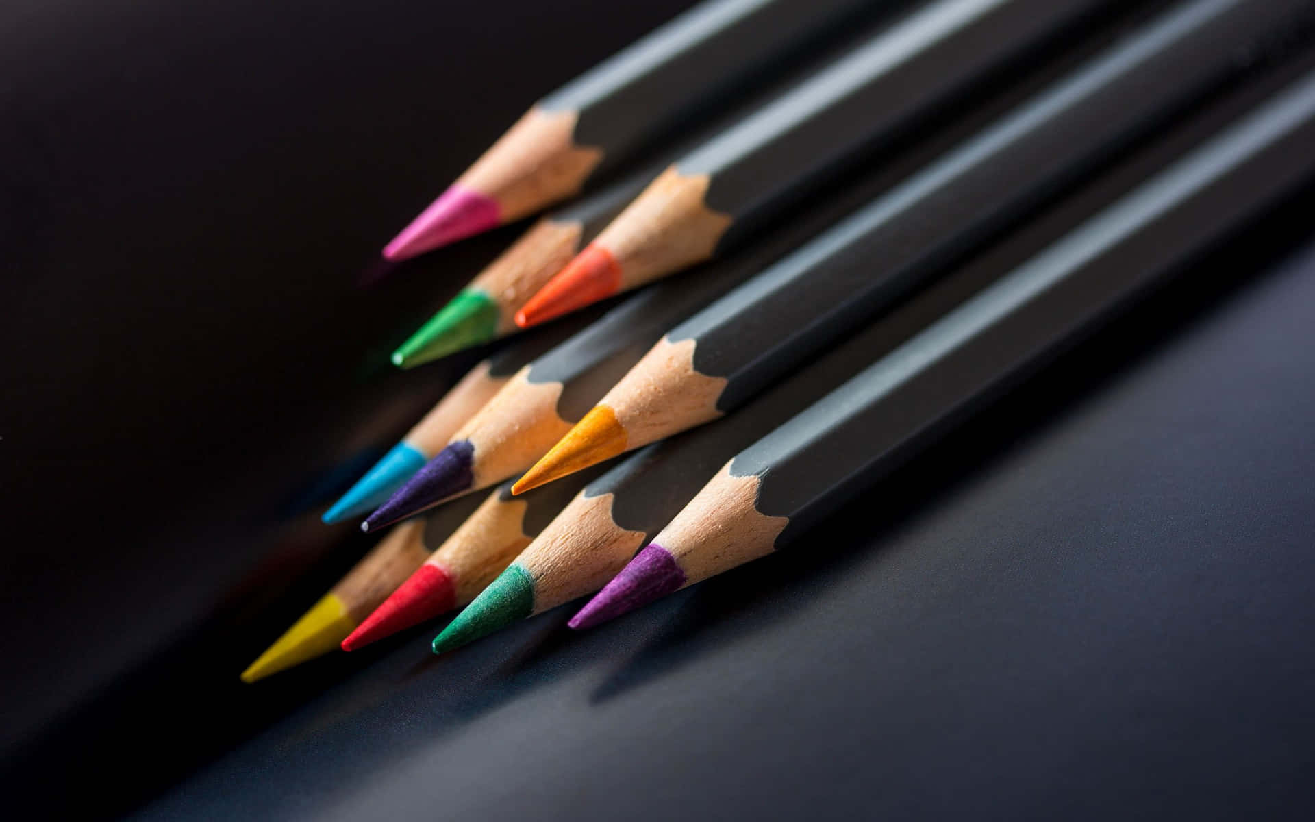 A simple, wooden pencil amongst a colorful background.