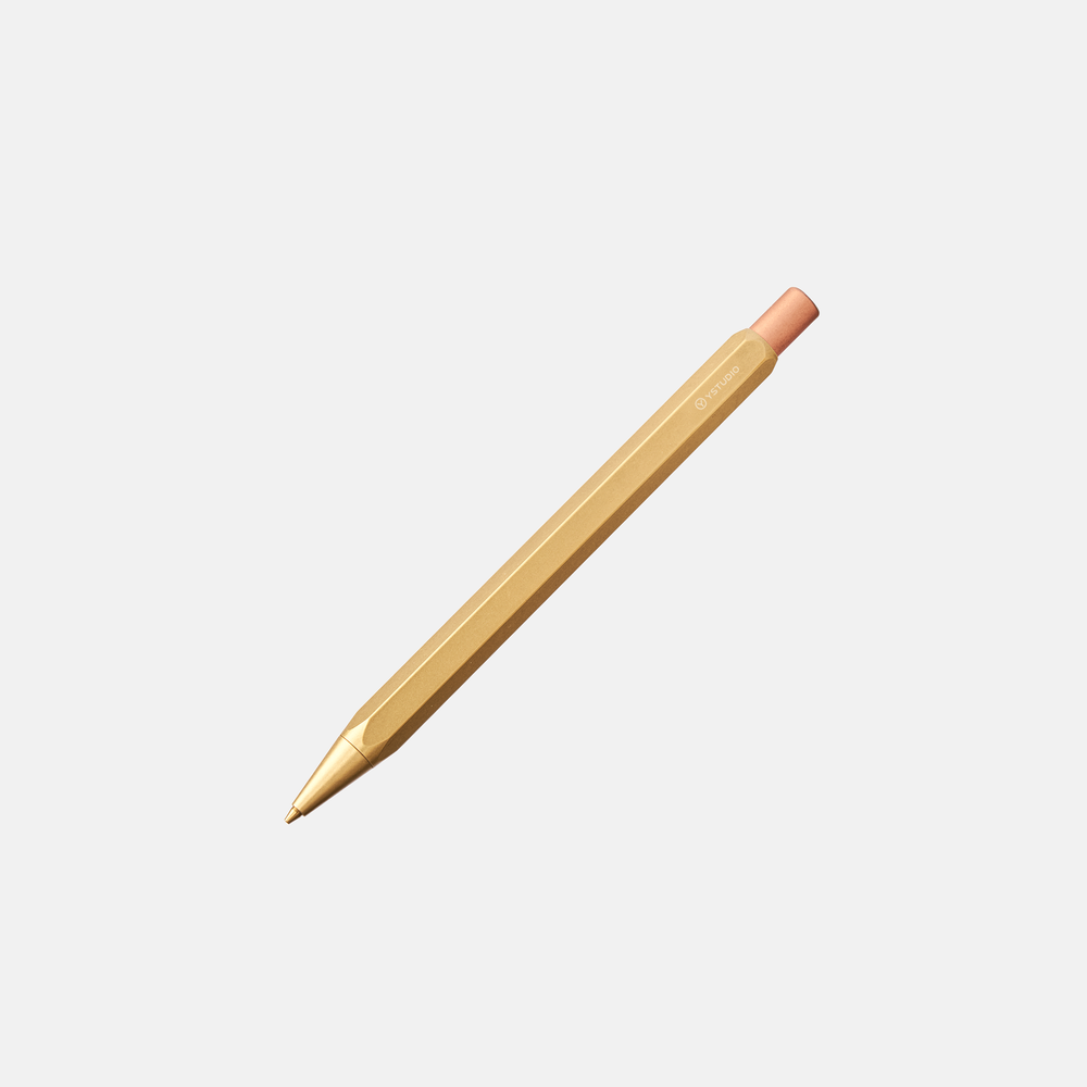 A bright yellow pencil lying against a white background.