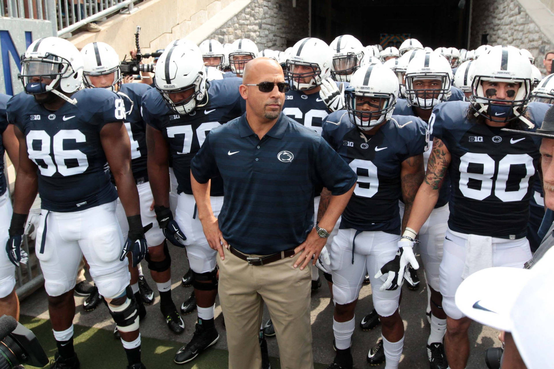 Pennsylvania State University Football Players And Coach Wallpaper