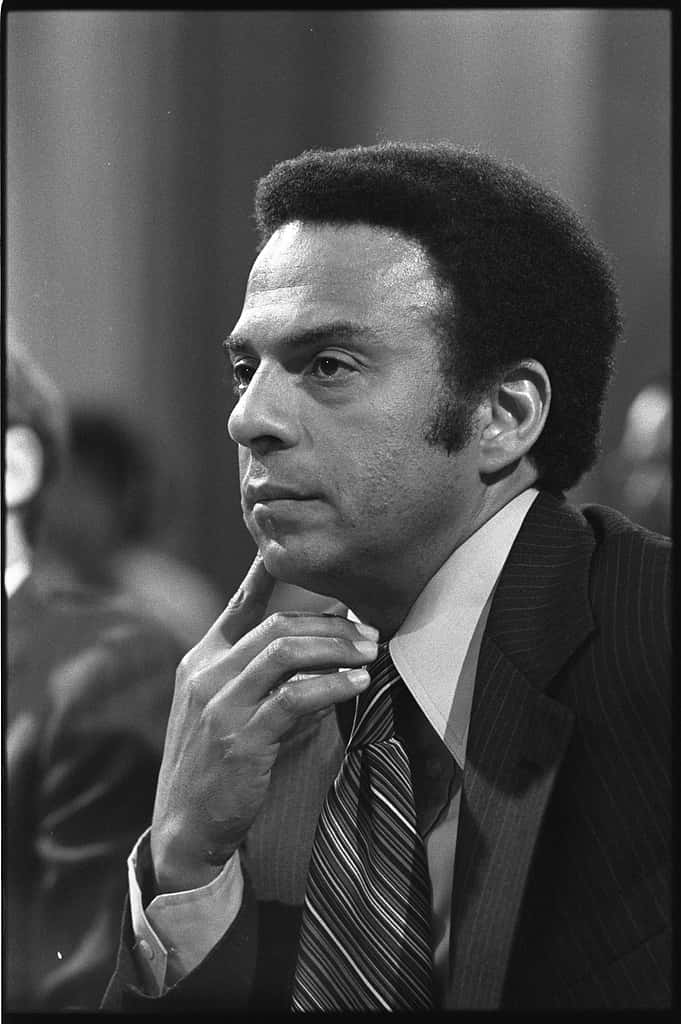Thoughtful Andrew Young in a Hearing Wallpaper