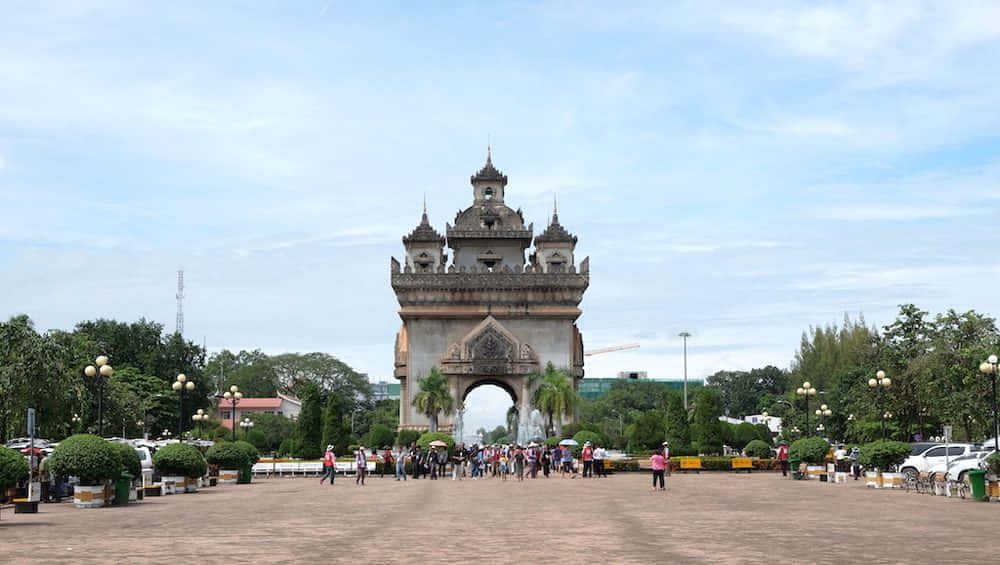 People Gathered Front Of Patuxai Wallpaper