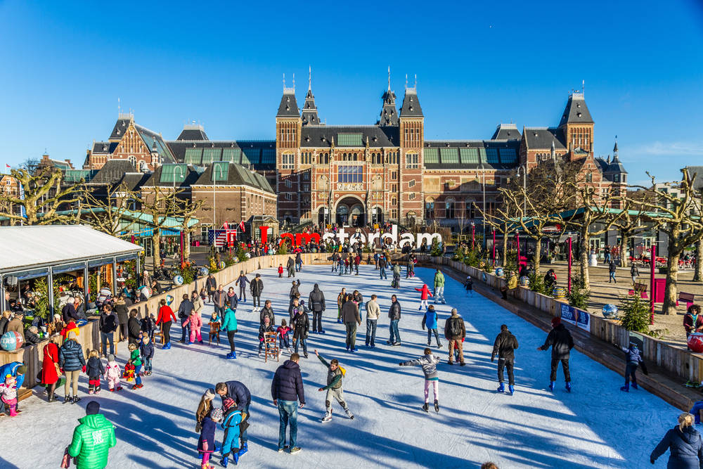 People Ice Skating Outside Rijksmuseum Background