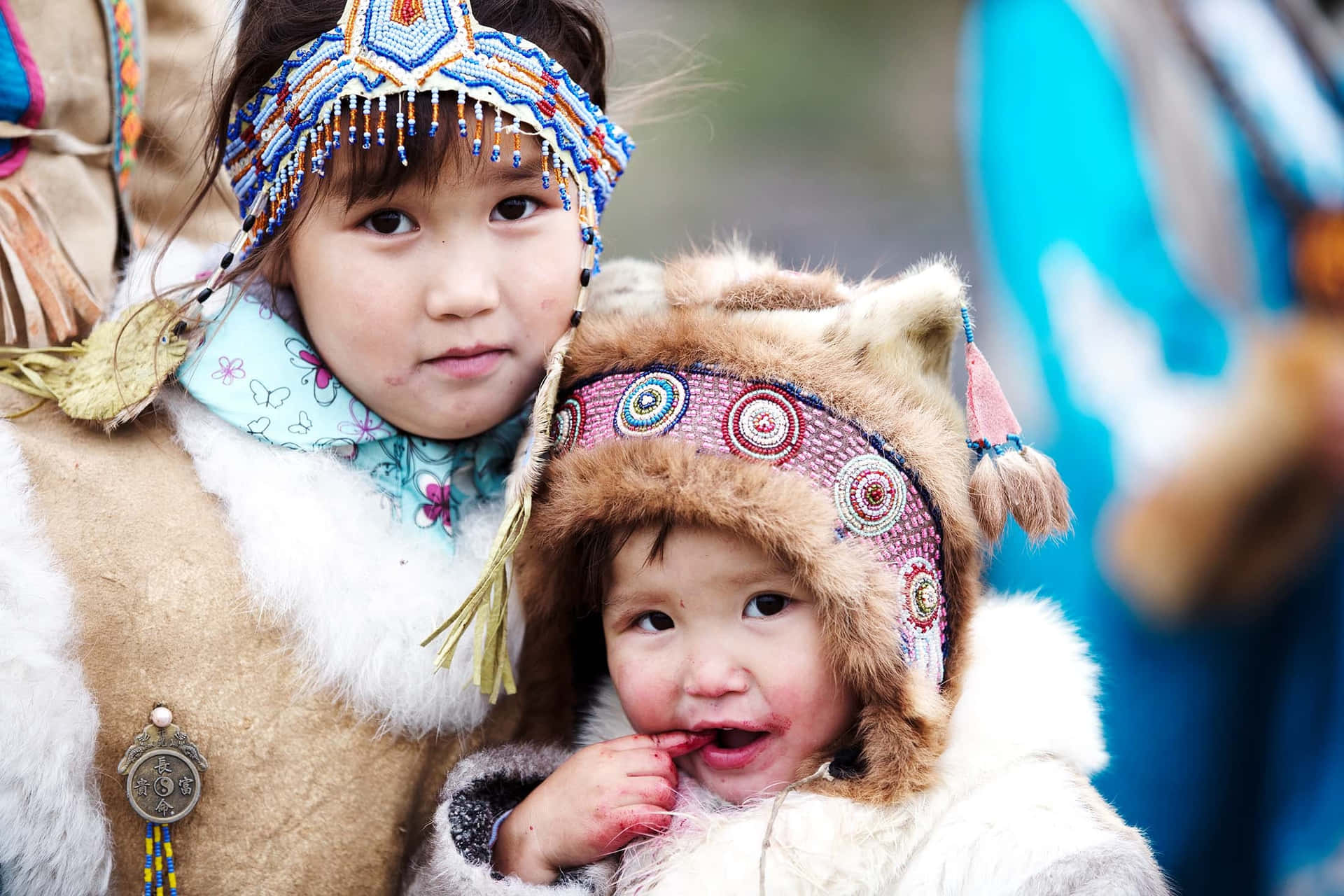 Two Children In Traditional Clothing Are Posing For A Photo