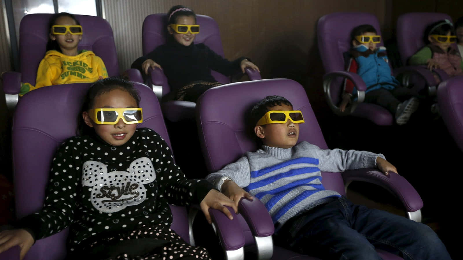 Children Wearing 3d Glasses In A Movie Theater