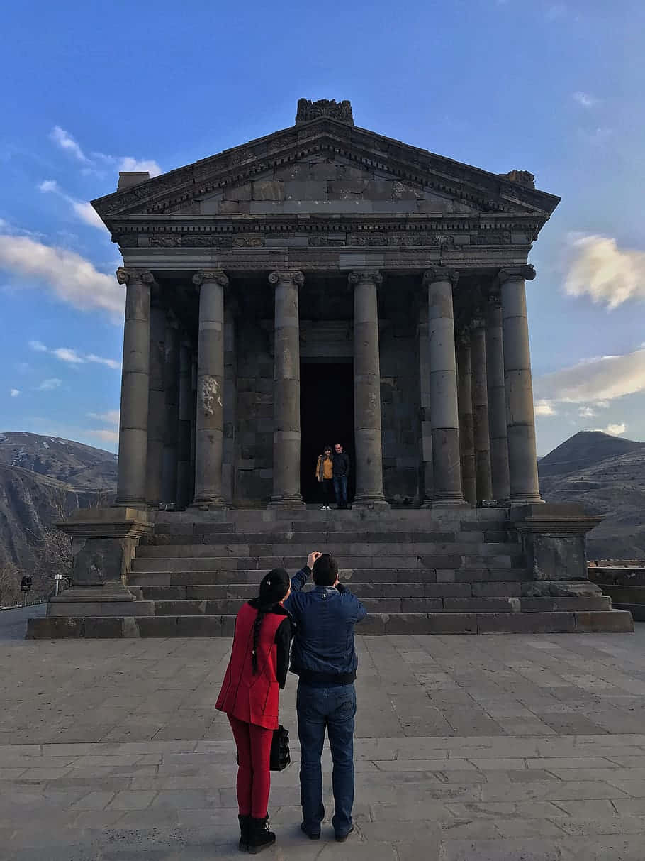 People Taking Pictures At Garni Temple Wallpaper